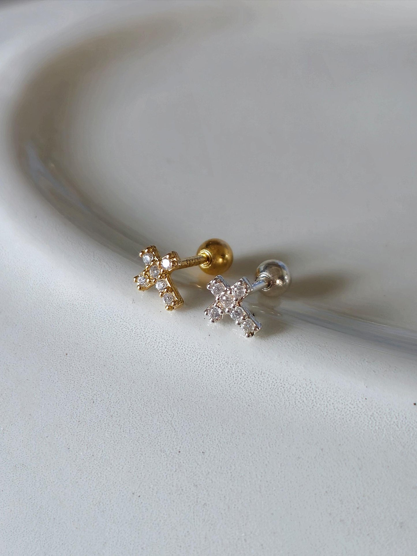 Minimal Cubic Cross Stud Piercing in 925 Sterling Silver.