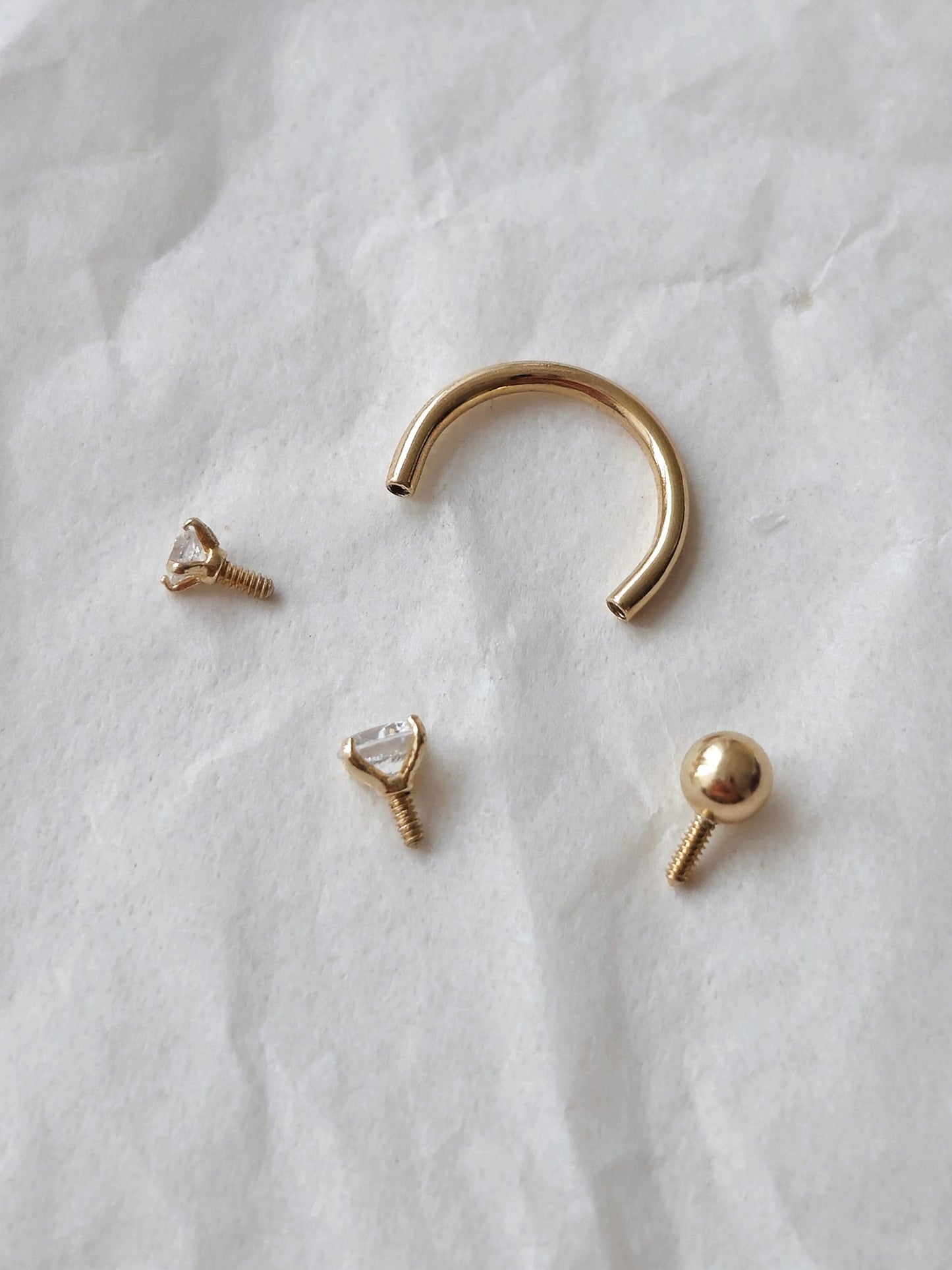 14k solid gold curve tube piercing. 2mm 3mm cubic ball piercing. U-shaped hoop.