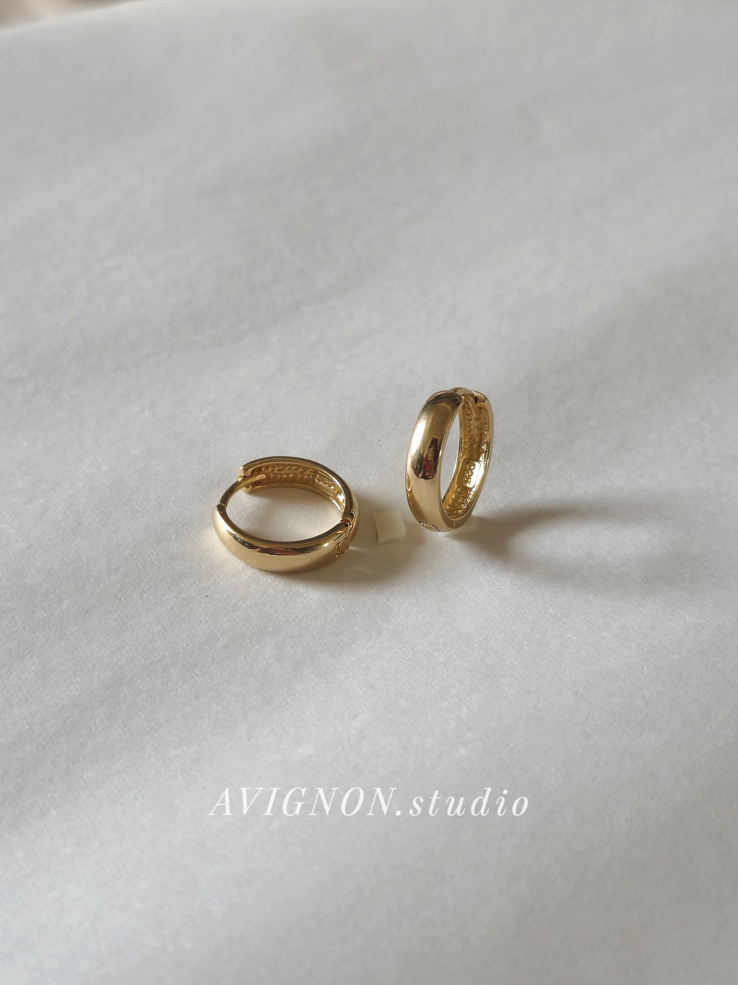 Minimal sterling silver hoop earrings.