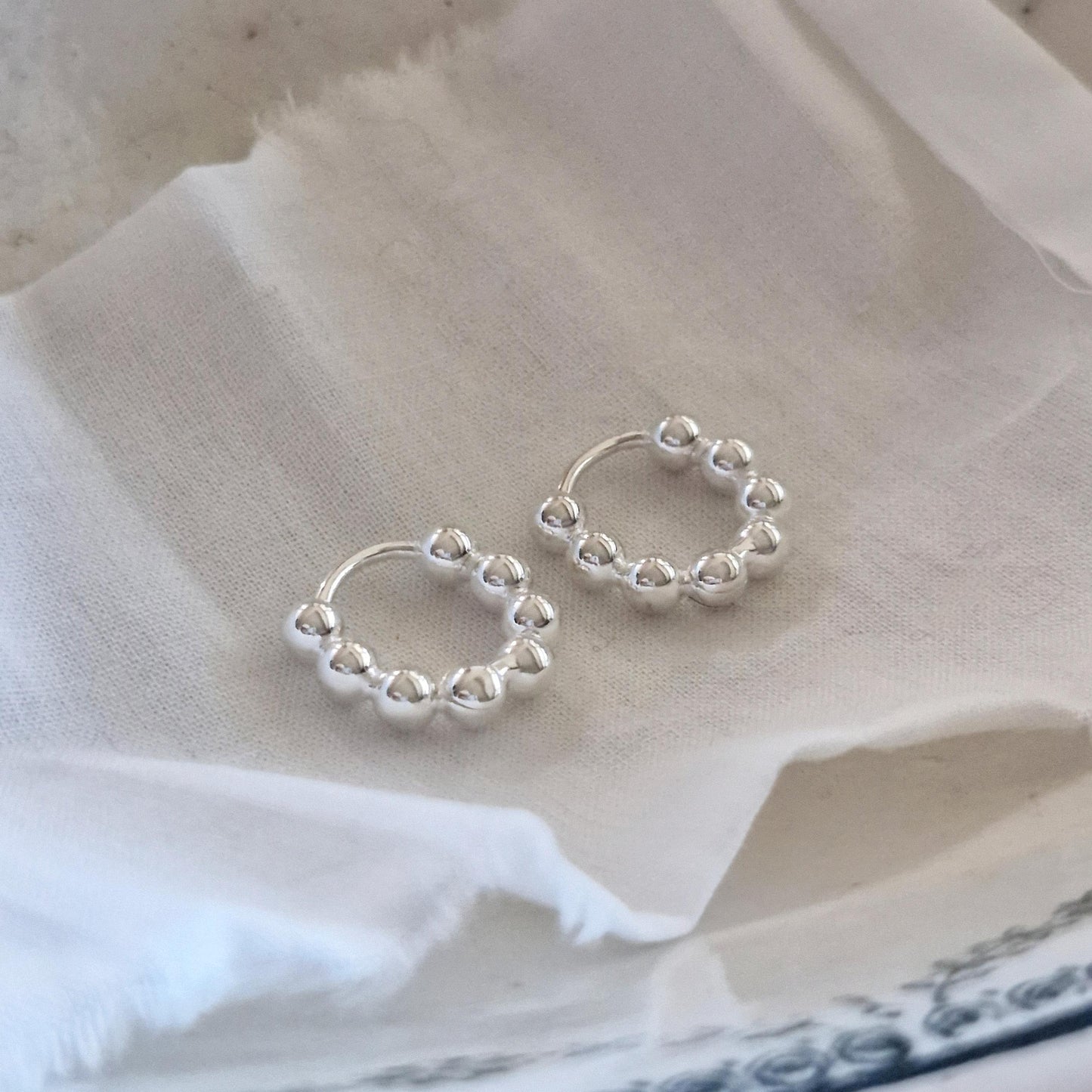 Bubble earrings. Basic hoop ball plain huggie earrings simple and chic. modernist design. clicker.