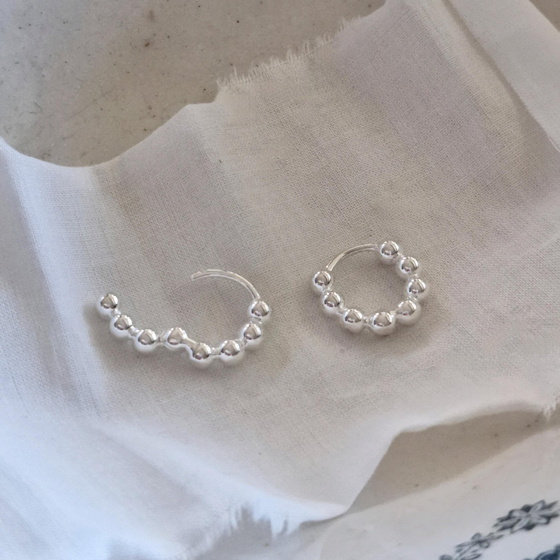 Bubble earrings. Basic hoop ball plain huggie earrings simple and chic. modernist design. clicker.