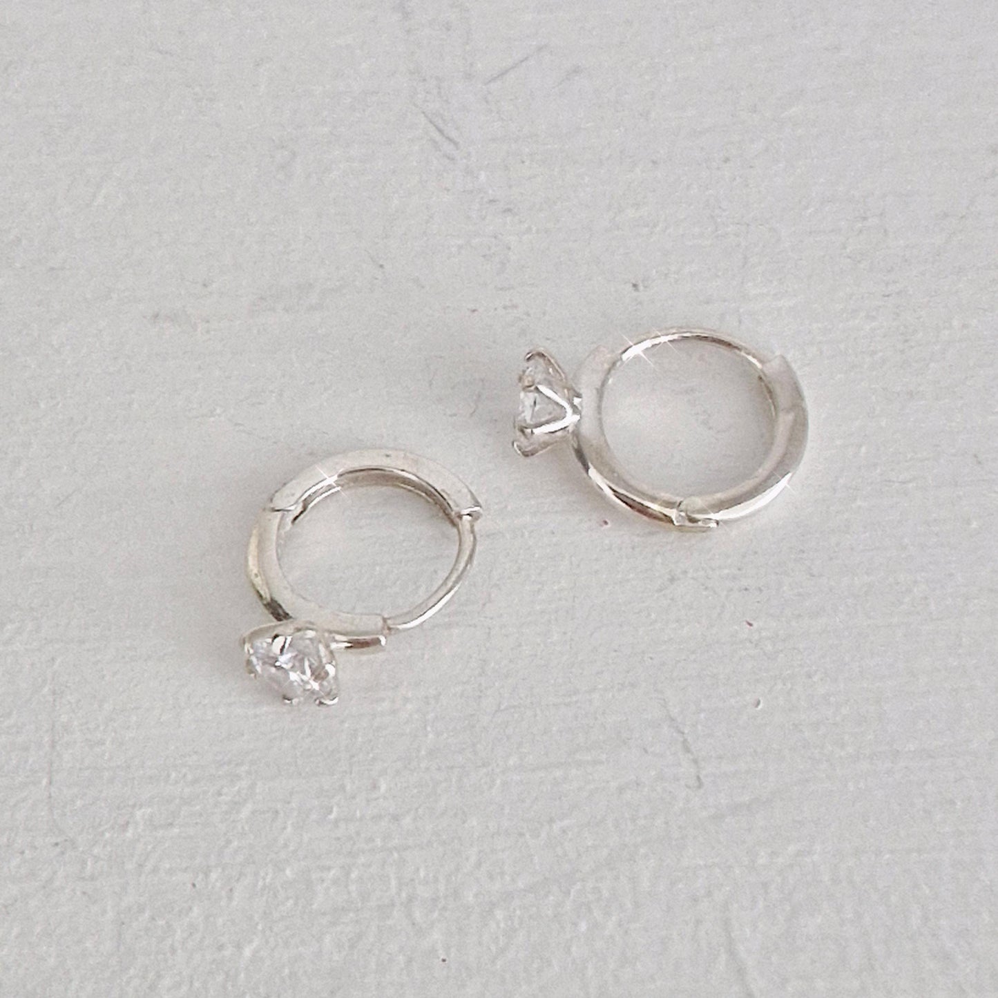 Classic Solitaire Hoop Earrings. solitaire cubic huggie earrings. 925 silver earrings. Hinged CZ Clicker Hoop