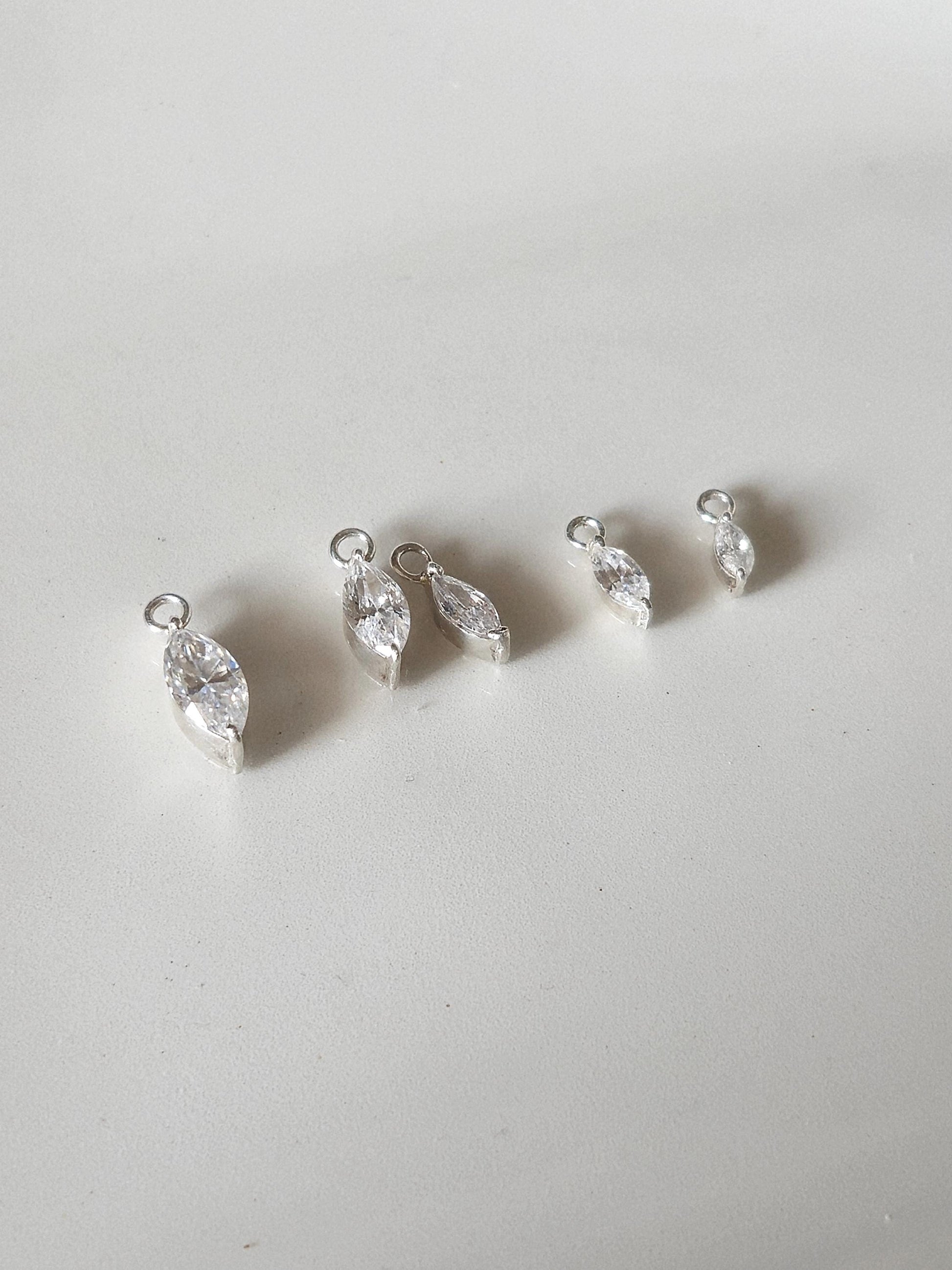 Marquise cut Moissanite Lab diamond Sterling silver hoop. (Sold as single piece)