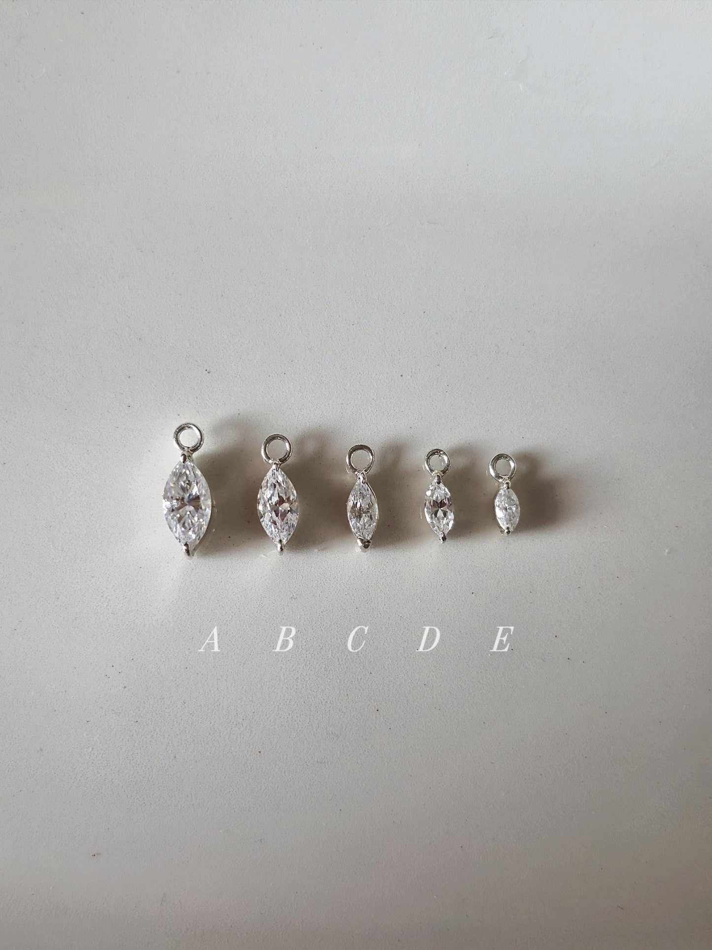 Marquise cut Moissanite Lab diamond Sterling silver hoop. (Sold as single piece)
