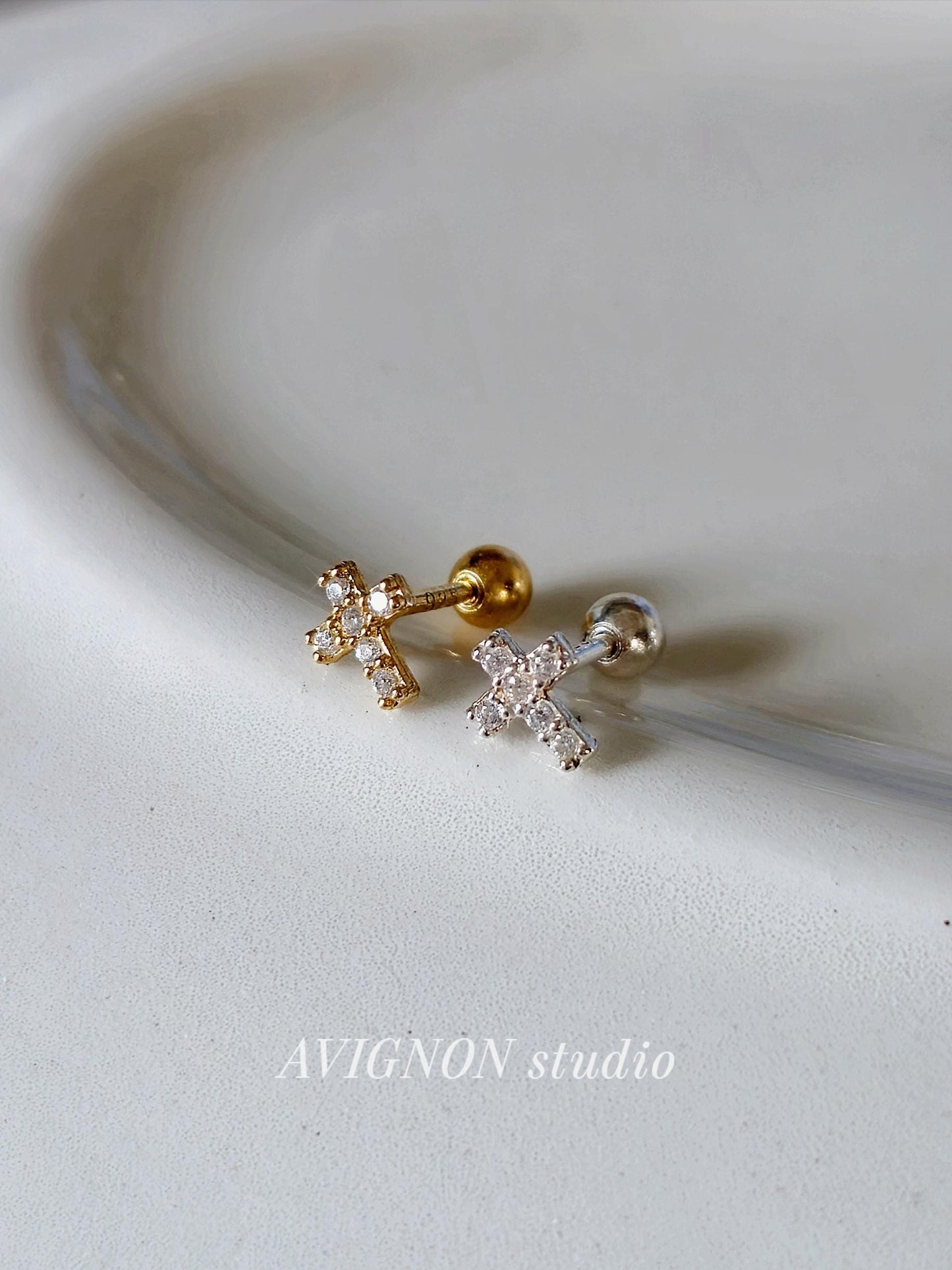 Minimal Cubic Cross Stud Piercing in 925 Sterling Silver.