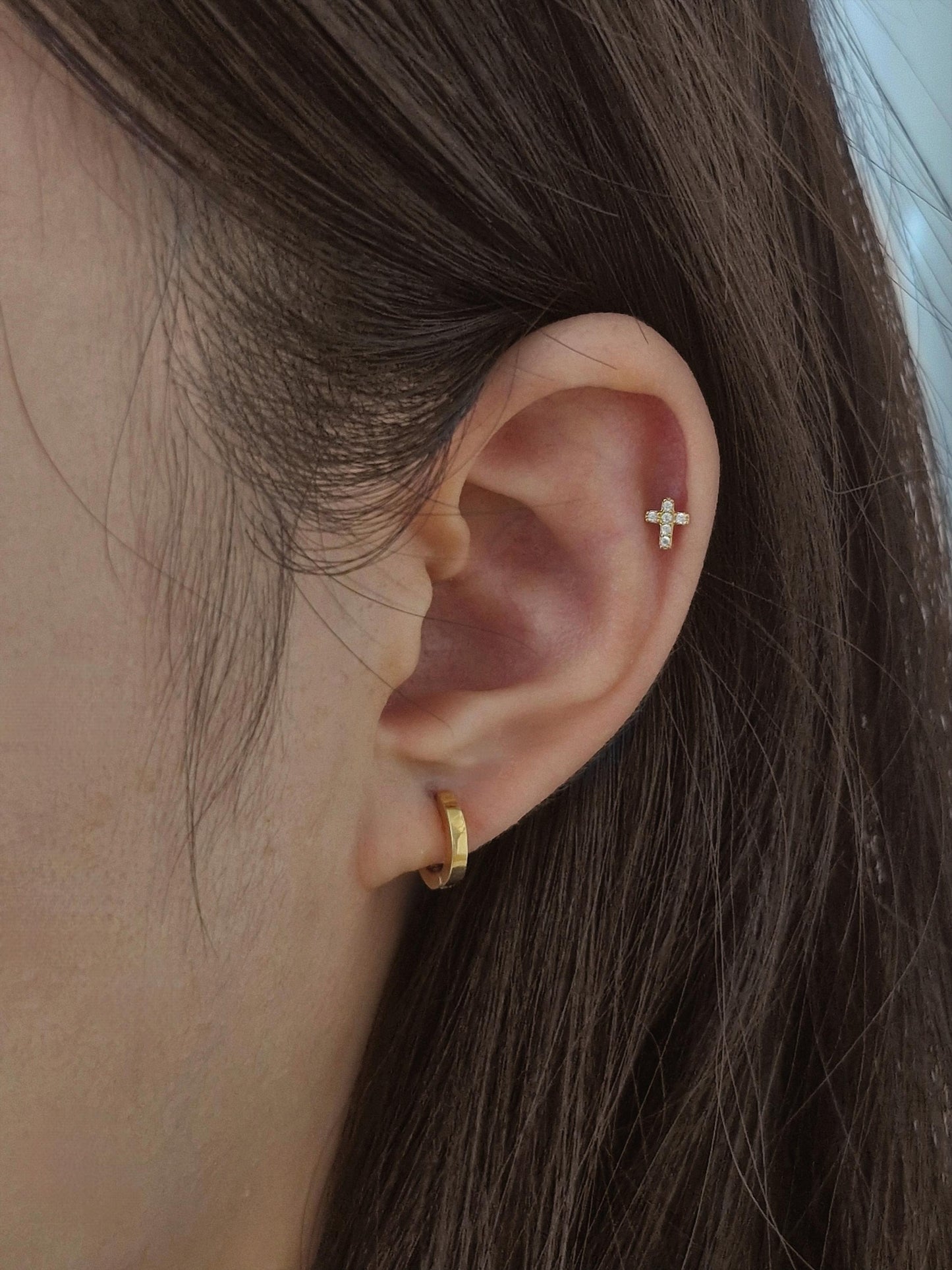 Minimal Cubic Cross Stud Piercing in 925 Sterling Silver.