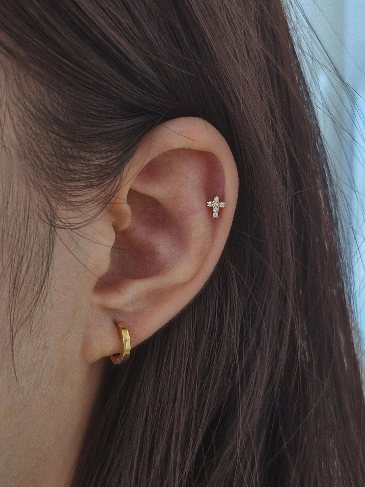 Minimal Cubic Cross Stud Piercing in 925 Sterling Silver.