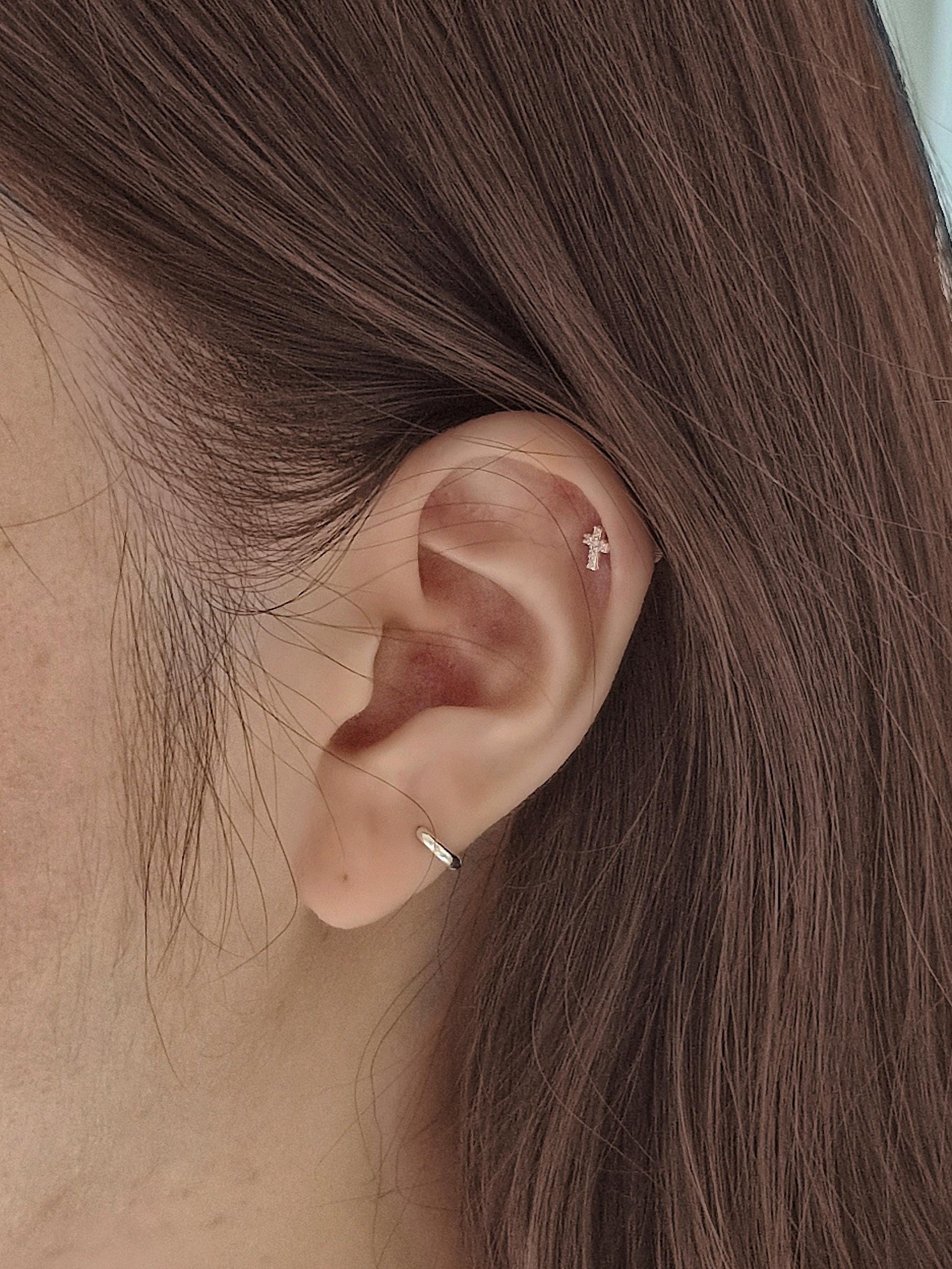 Minimal Cubic Cross Stud Piercing in 925 Sterling Silver.