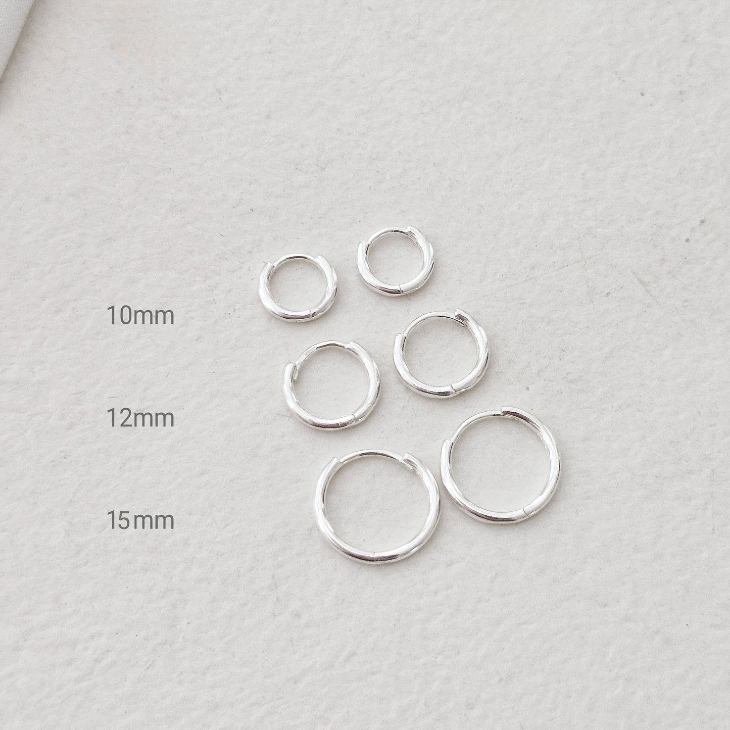 Sterling Silver 925 Earrings (10mm / 12mm / 15mm). dainty hoop huggie earring. modernist. Hinged clicker. 1.5mm hoop earrings.