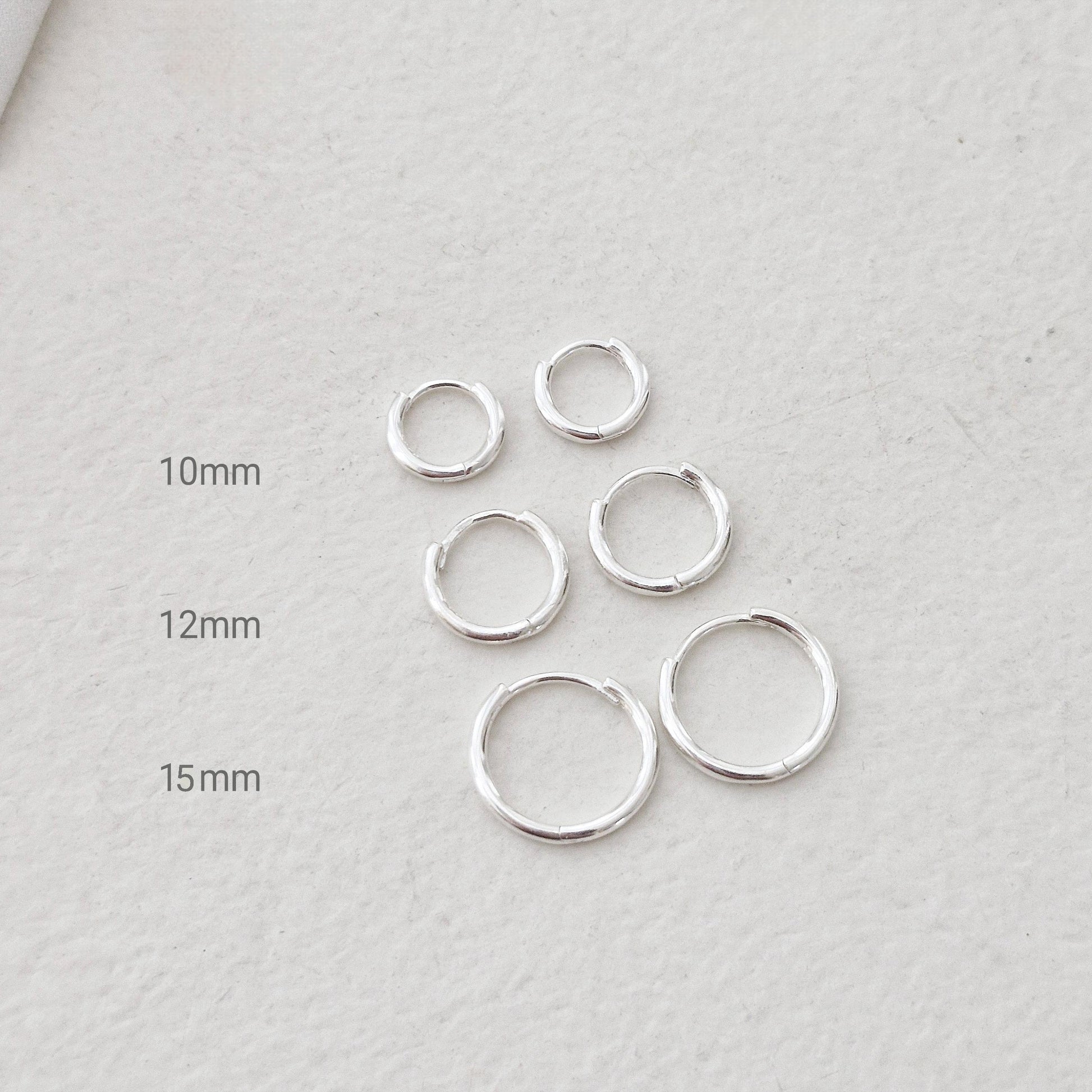 Sterling Silver 925 Earrings (10mm / 12mm / 15mm). dainty hoop huggie earring. modernist. Hinged clicker. 1.5mm hoop earrings.