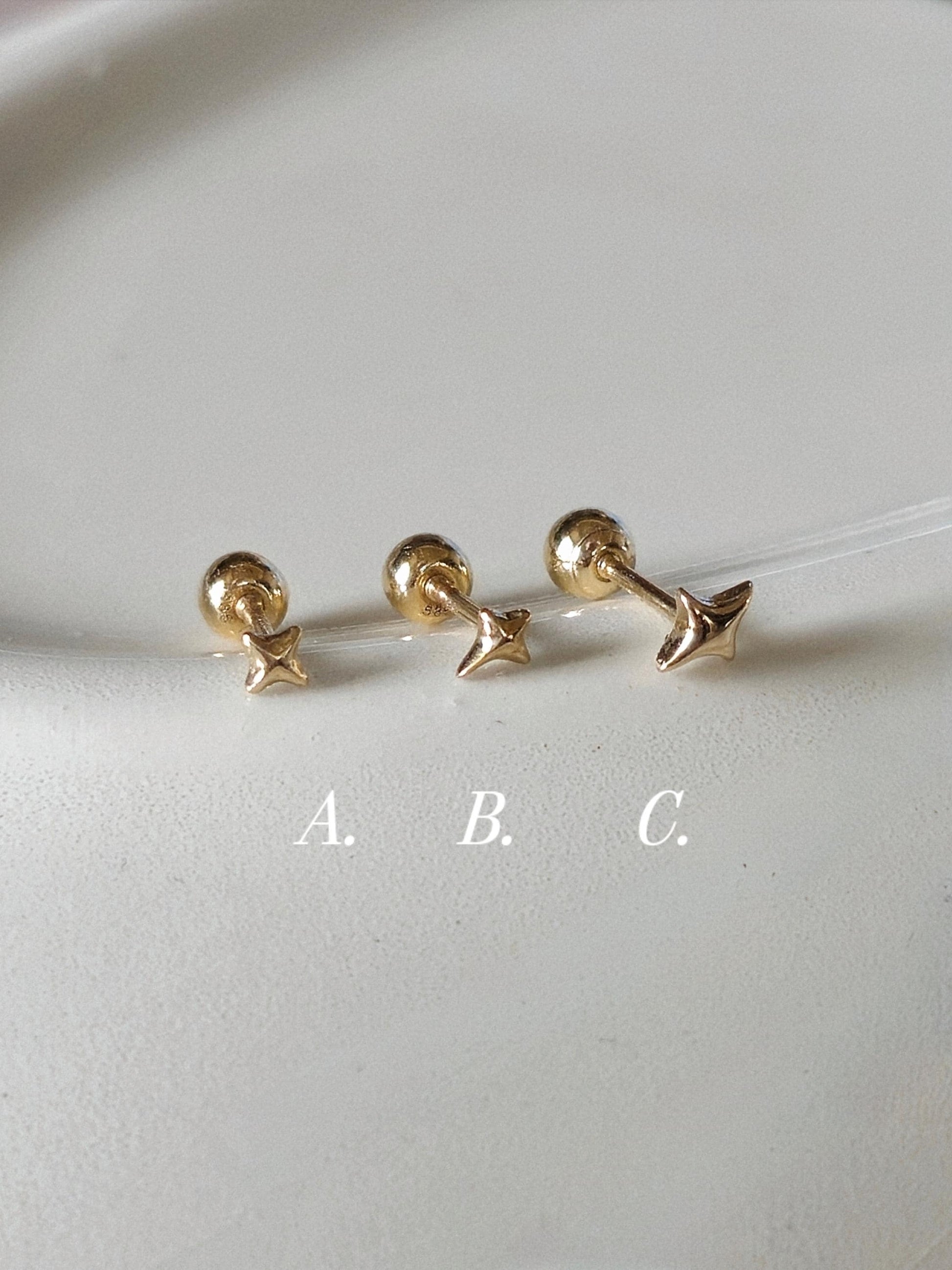 Tiny Star Stud piercing. solid gold 14k star screwball stud.