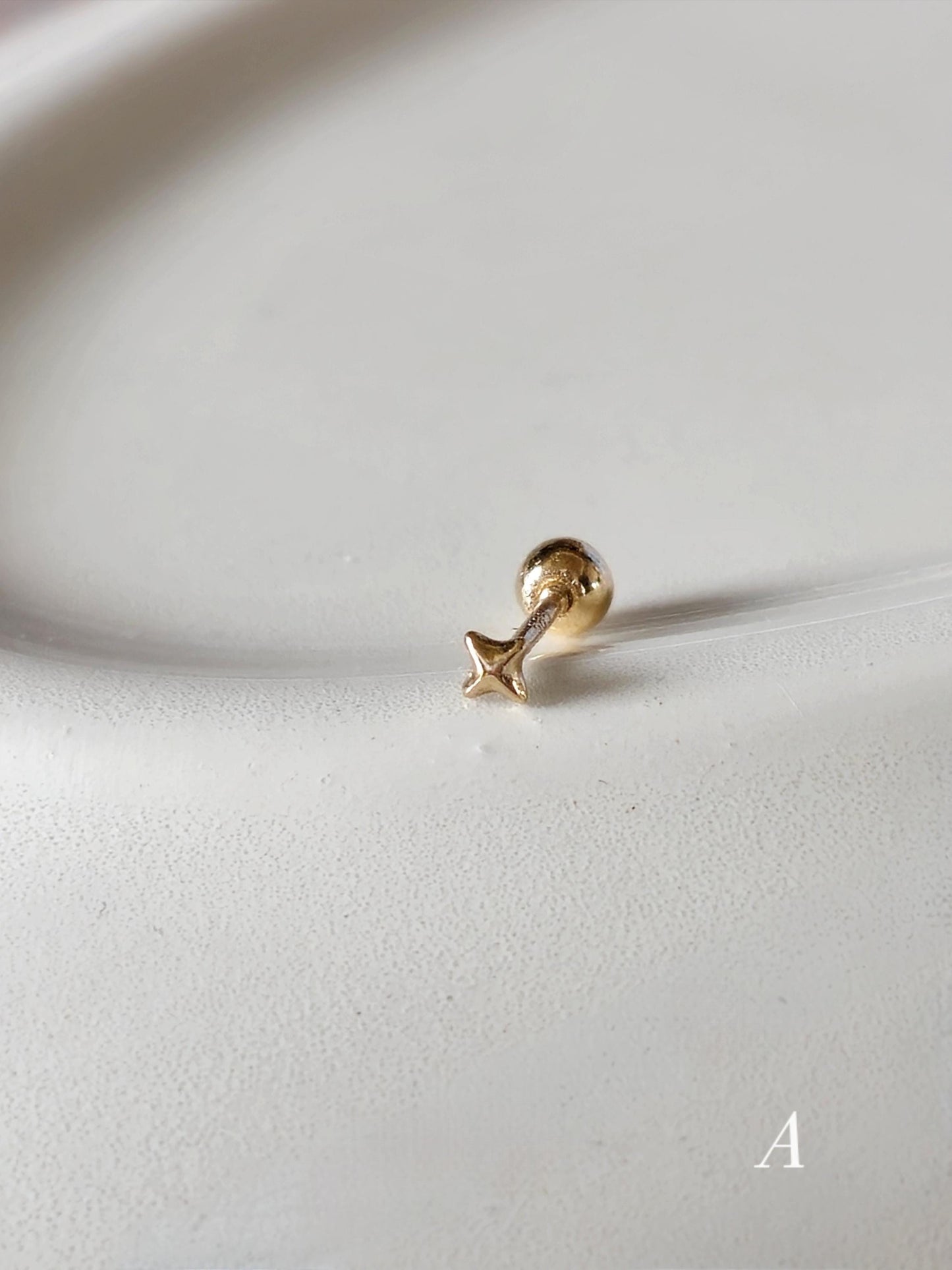 Tiny Star Stud piercing. solid gold 14k star screwball stud.
