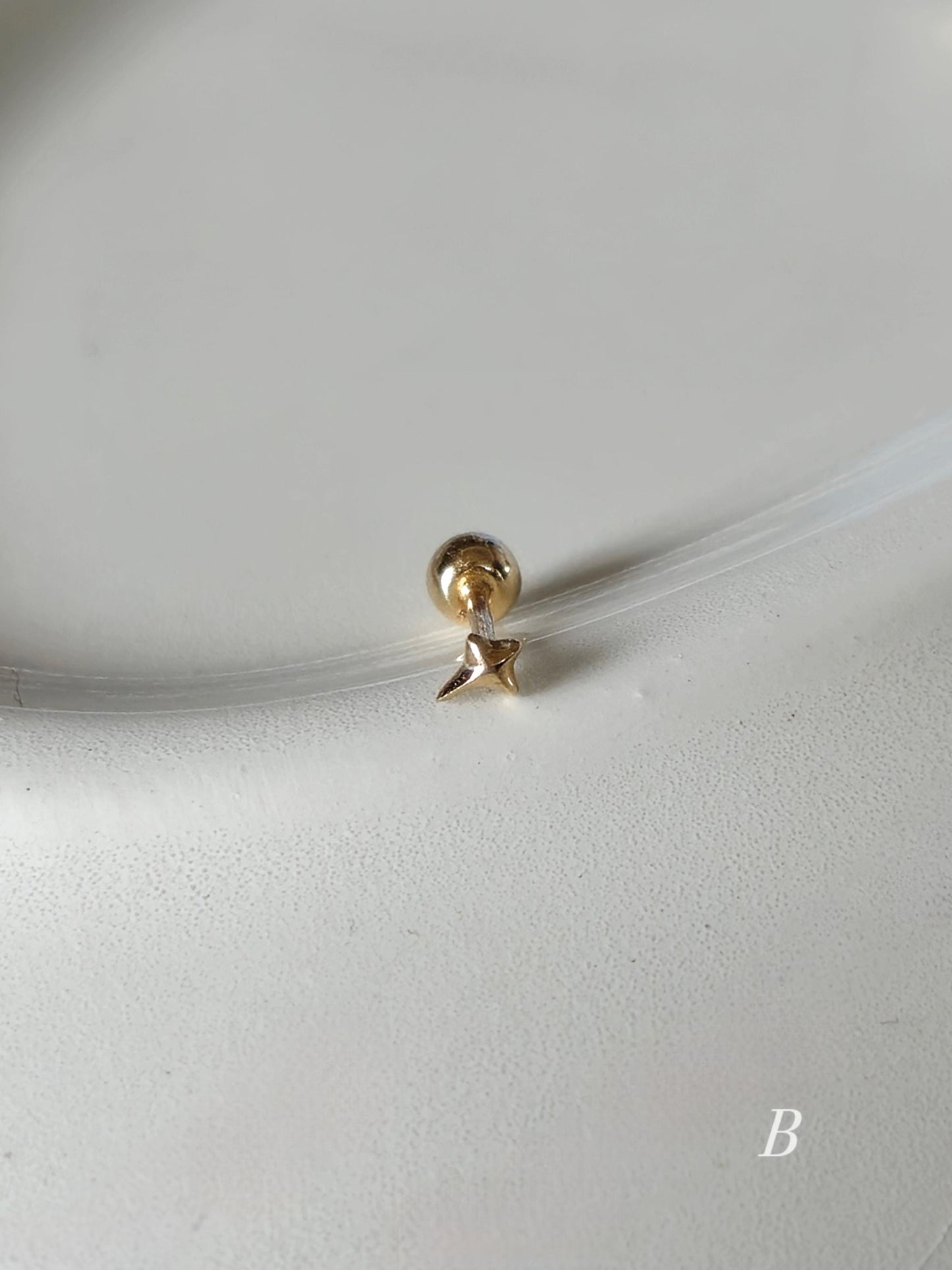 Tiny Star Stud piercing. solid gold 14k star screwball stud.