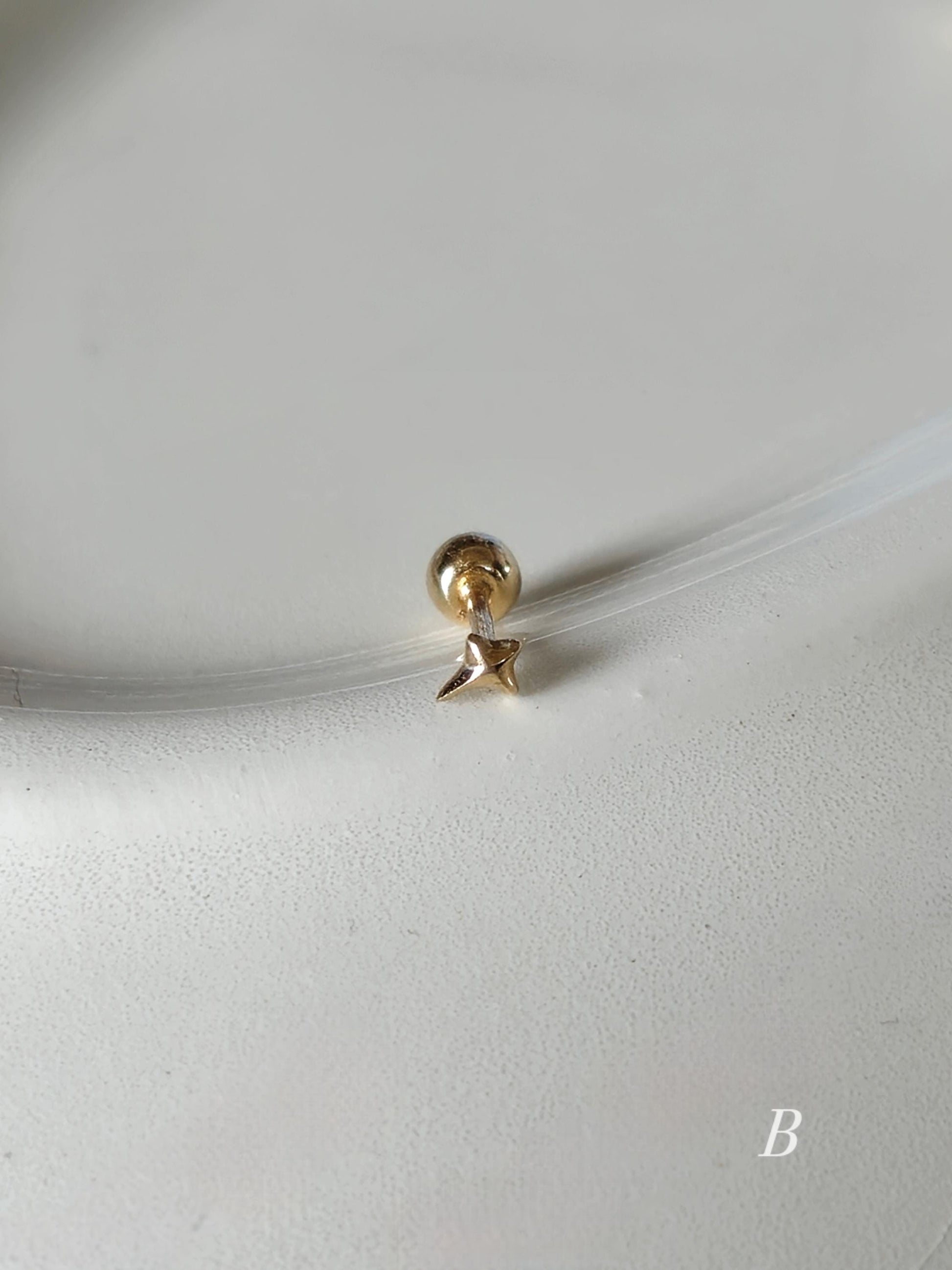 Tiny Star Stud piercing. solid gold 14k star screwball stud.