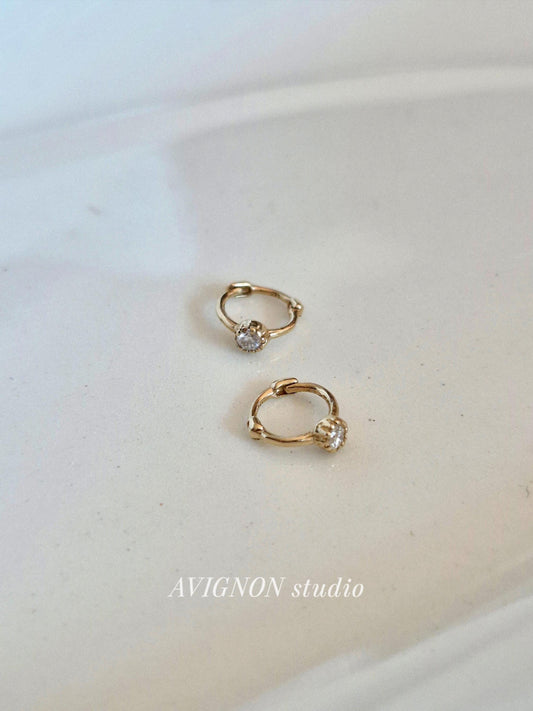 Tiny moisanite lab diamond 14k hoop earring.  solid gold hoop hinged clicker.