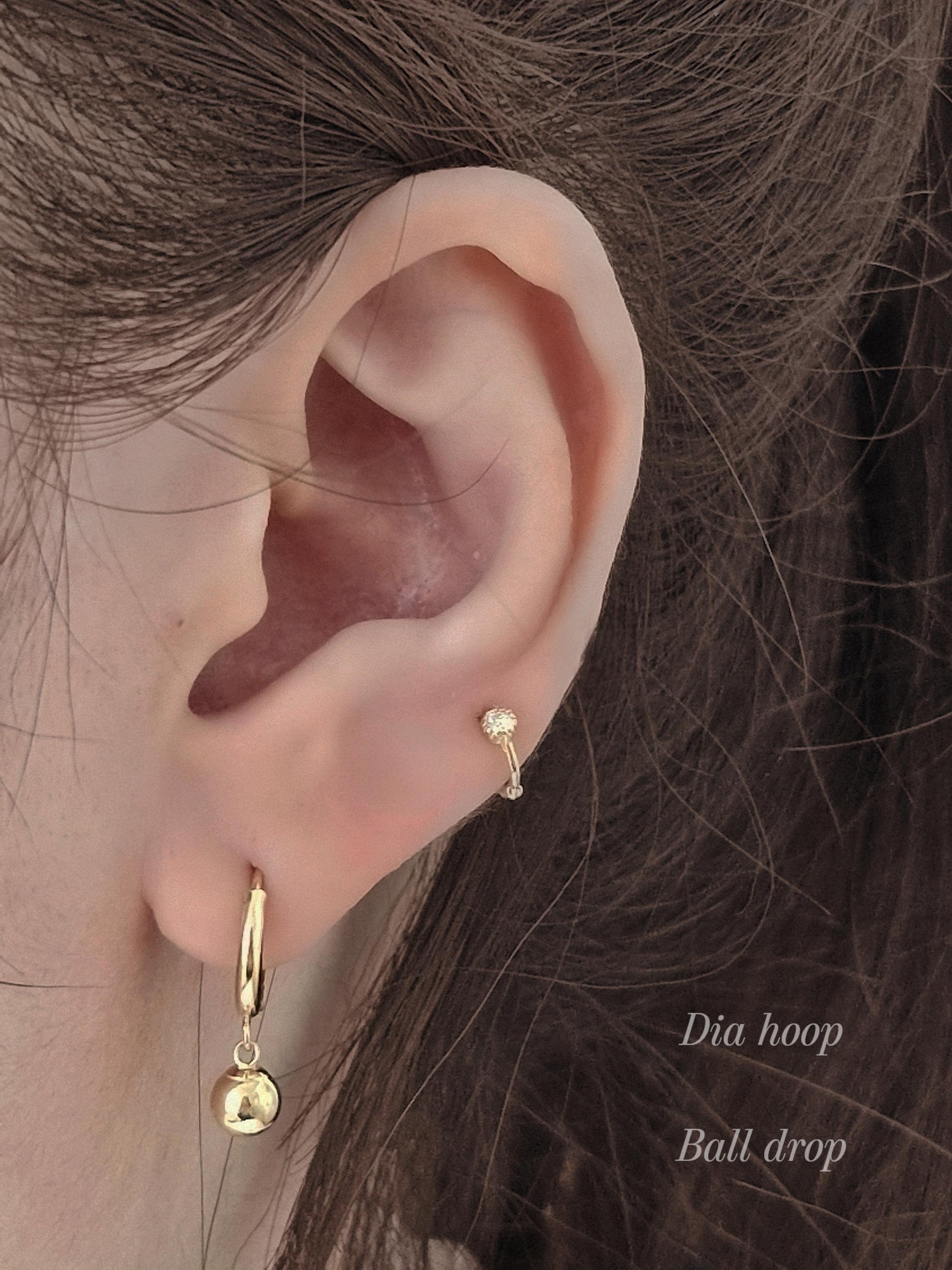 Tiny moisanite lab diamond 14k hoop earring.  solid gold hoop hinged clicker.