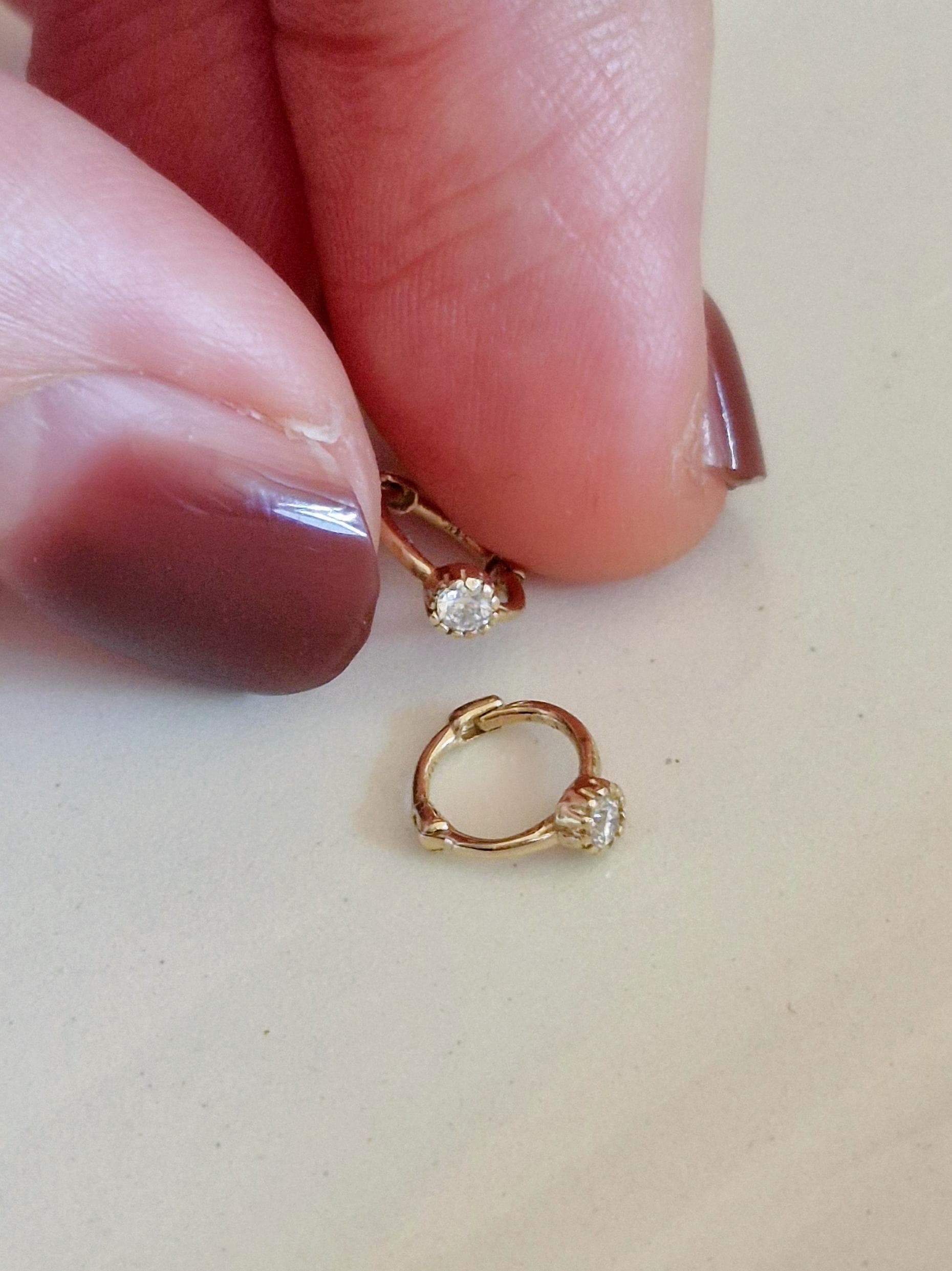 Tiny moisanite lab diamond 14k hoop earring.  solid gold hoop hinged clicker.