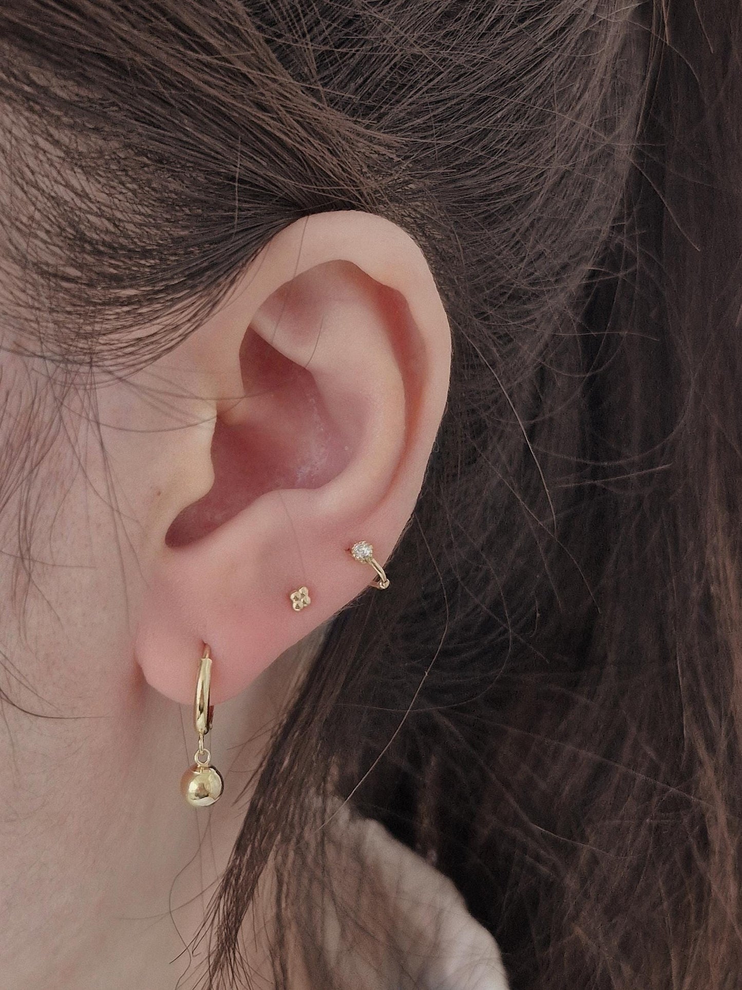 Tiny moisanite lab diamond 14k hoop earring.  solid gold hoop hinged clicker.