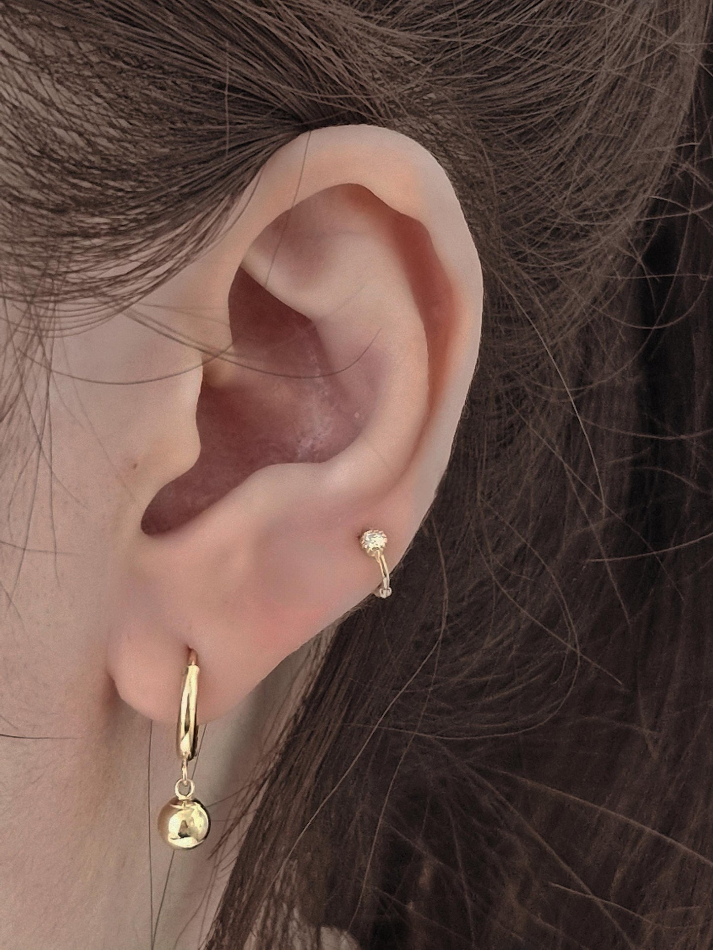 Tiny moisanite lab diamond 14k hoop earring.  solid gold hoop hinged clicker.