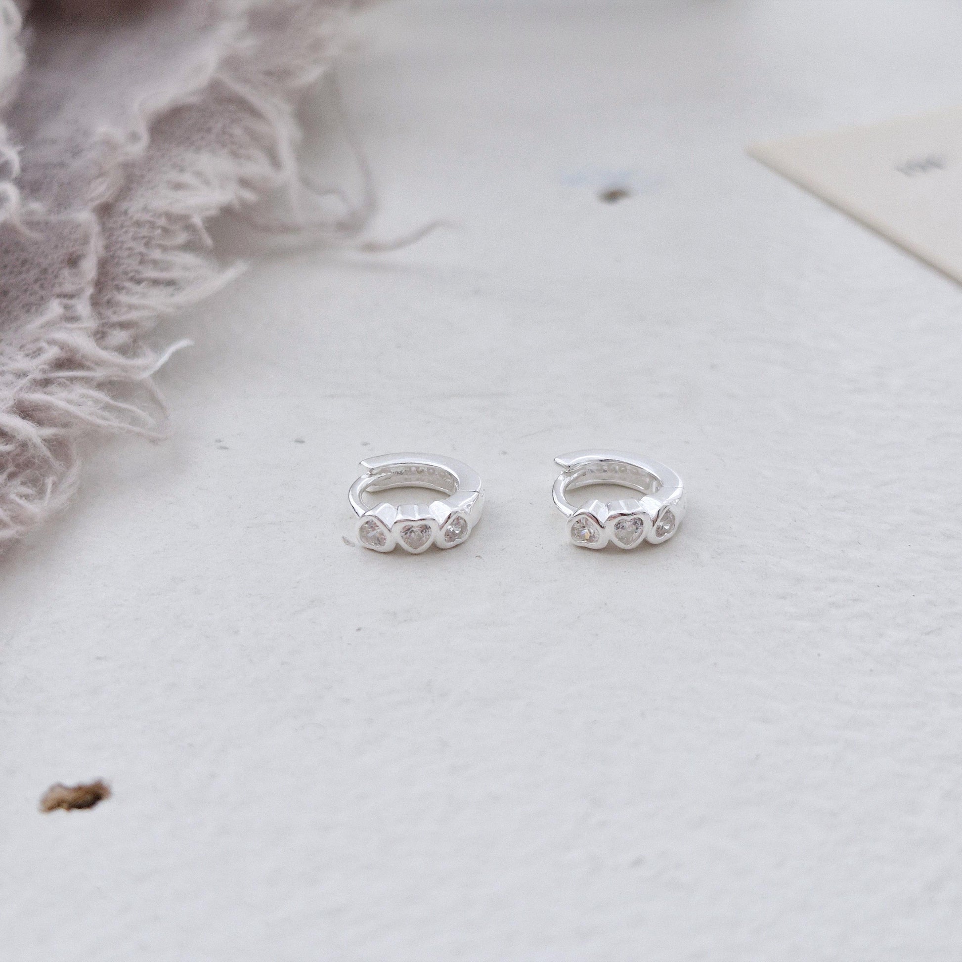 Triple Heart Huggie Earrings – Sterling Silver earring zirconia. Hinged CZ Clicker Hoop. clicker.