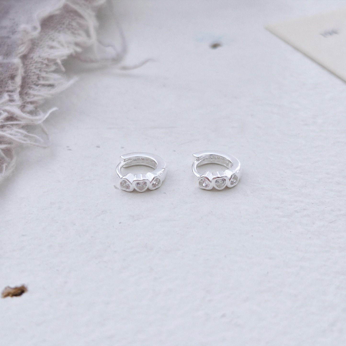 Triple Heart Huggie Earrings – Sterling Silver earring zirconia. Hinged CZ Clicker Hoop. clicker.