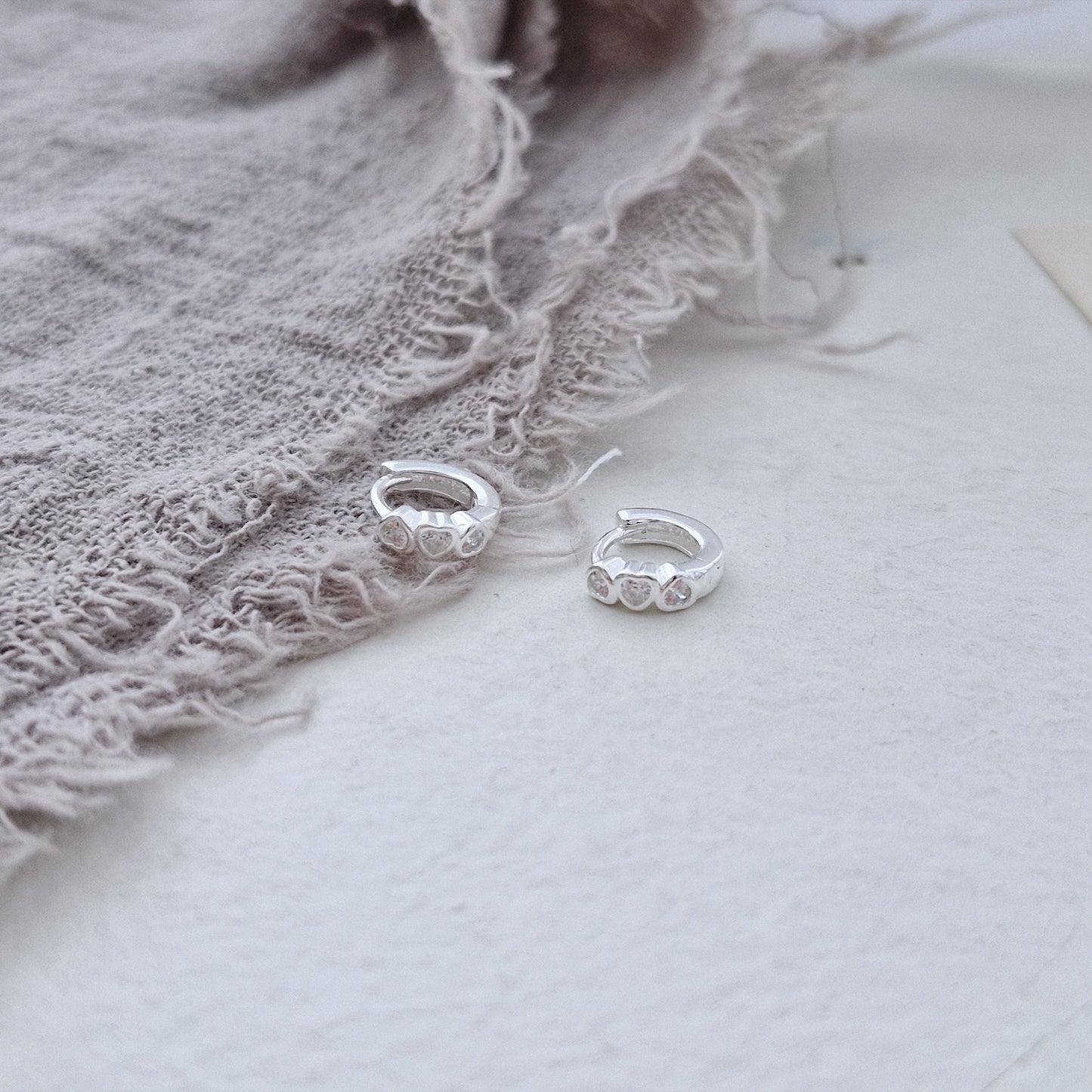 Triple Heart Huggie Earrings – Sterling Silver earring zirconia. Hinged CZ Clicker Hoop. clicker.