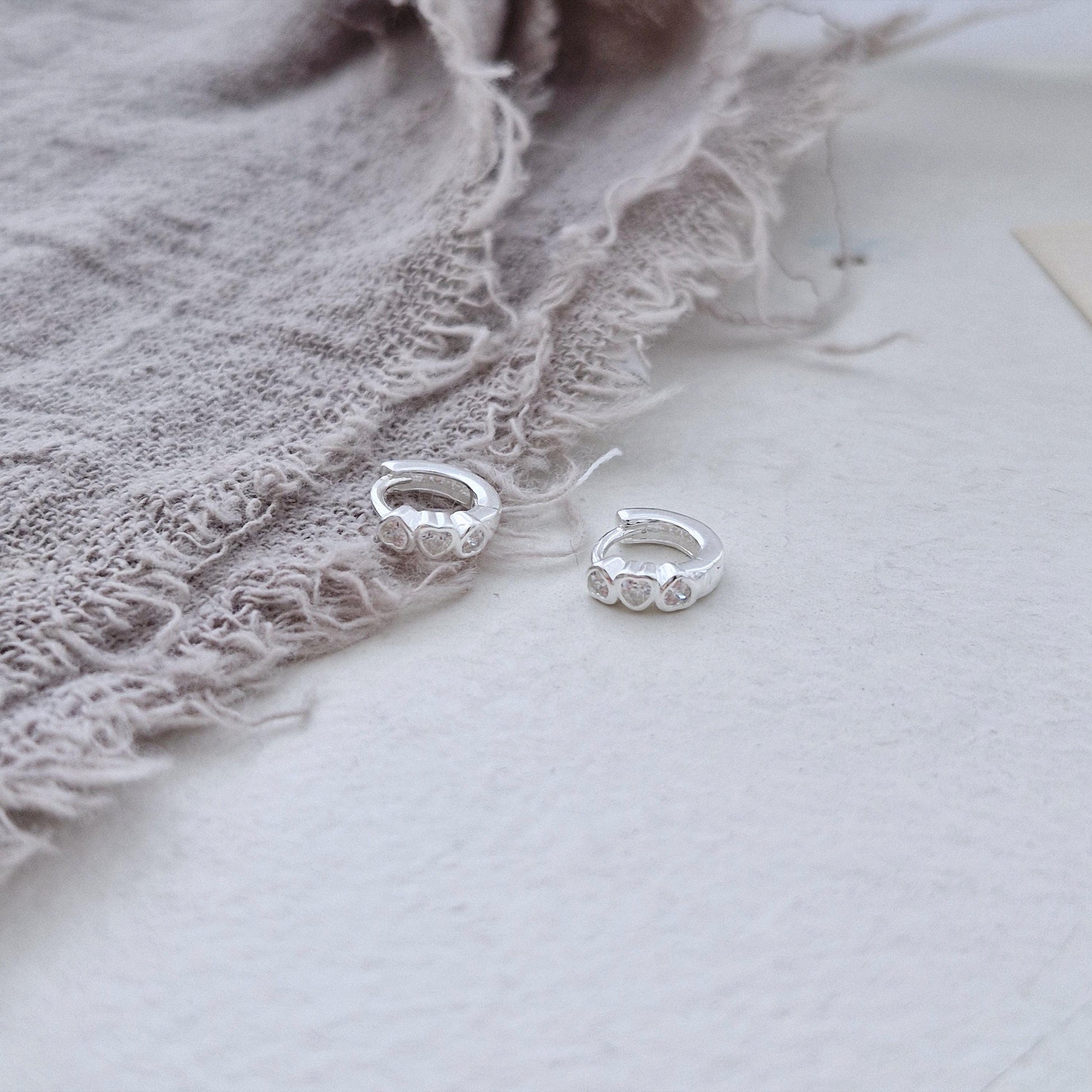 Triple Heart Huggie Earrings – Sterling Silver earring zirconia. Hinged CZ Clicker Hoop. clicker.