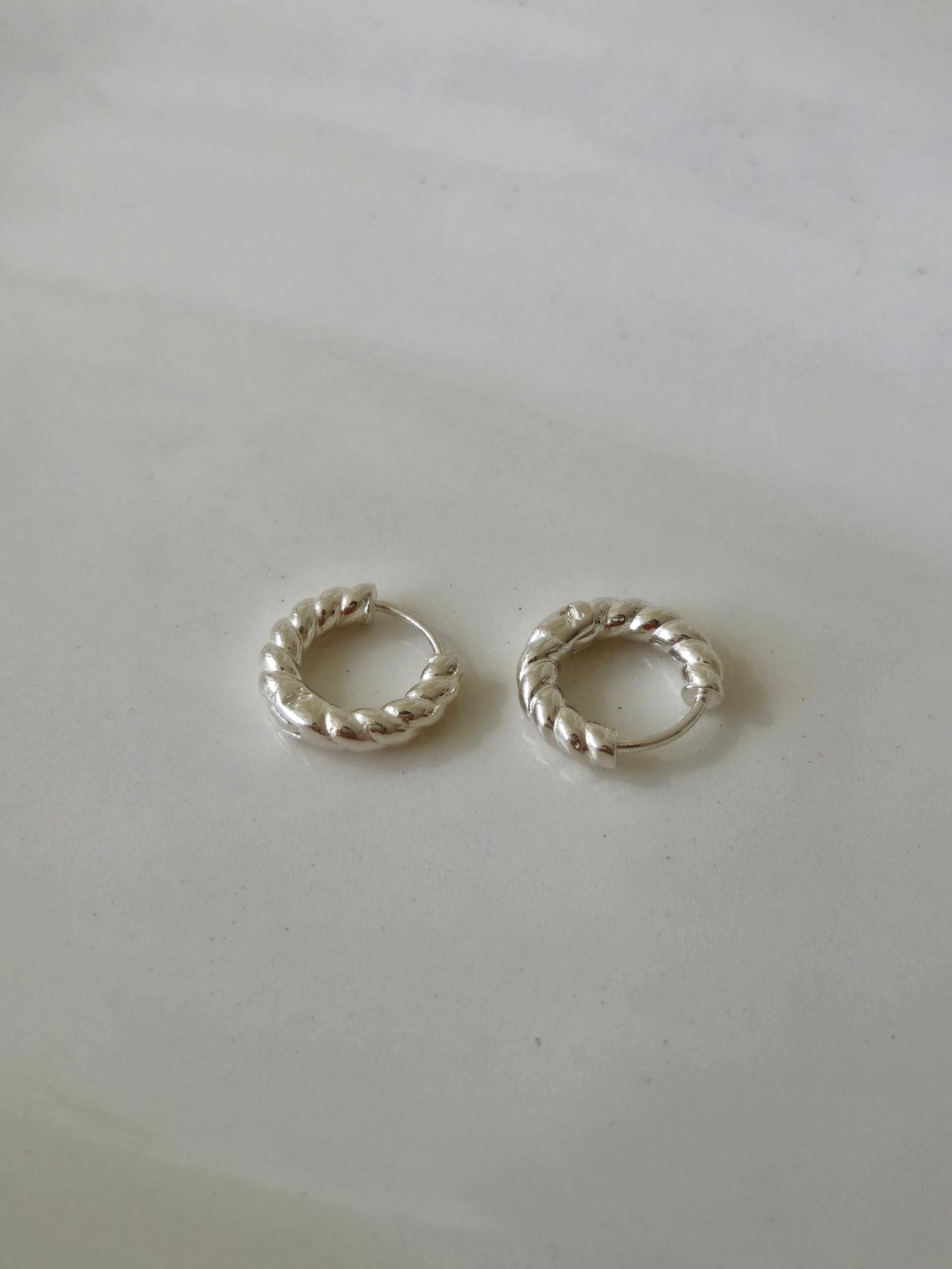 Twisted Hoop Earrings. Dainty sterling silver earrings. Twisted hinge Huggie.Croissant hoop earrings.