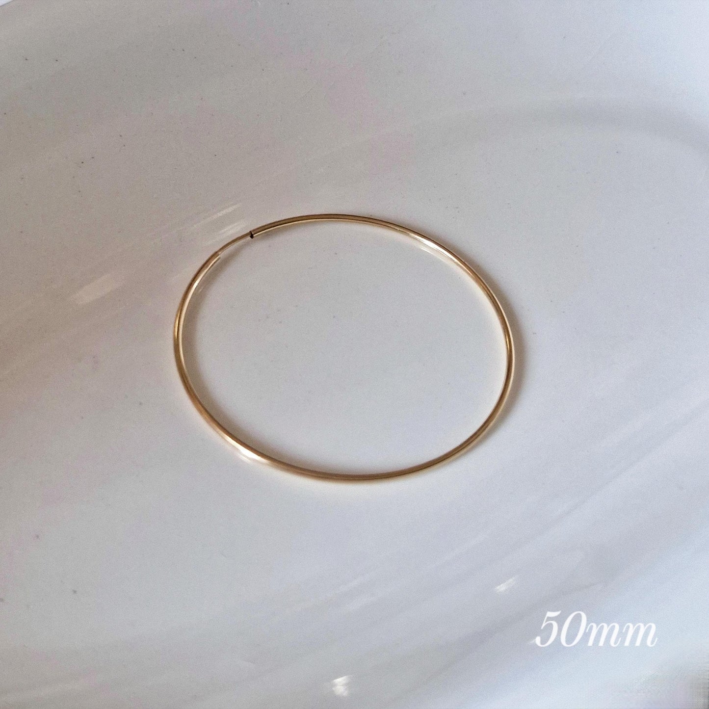 1.5mm gold filled hoop earring. lightweight pipe hoop earrings. endless hoop gold filled.