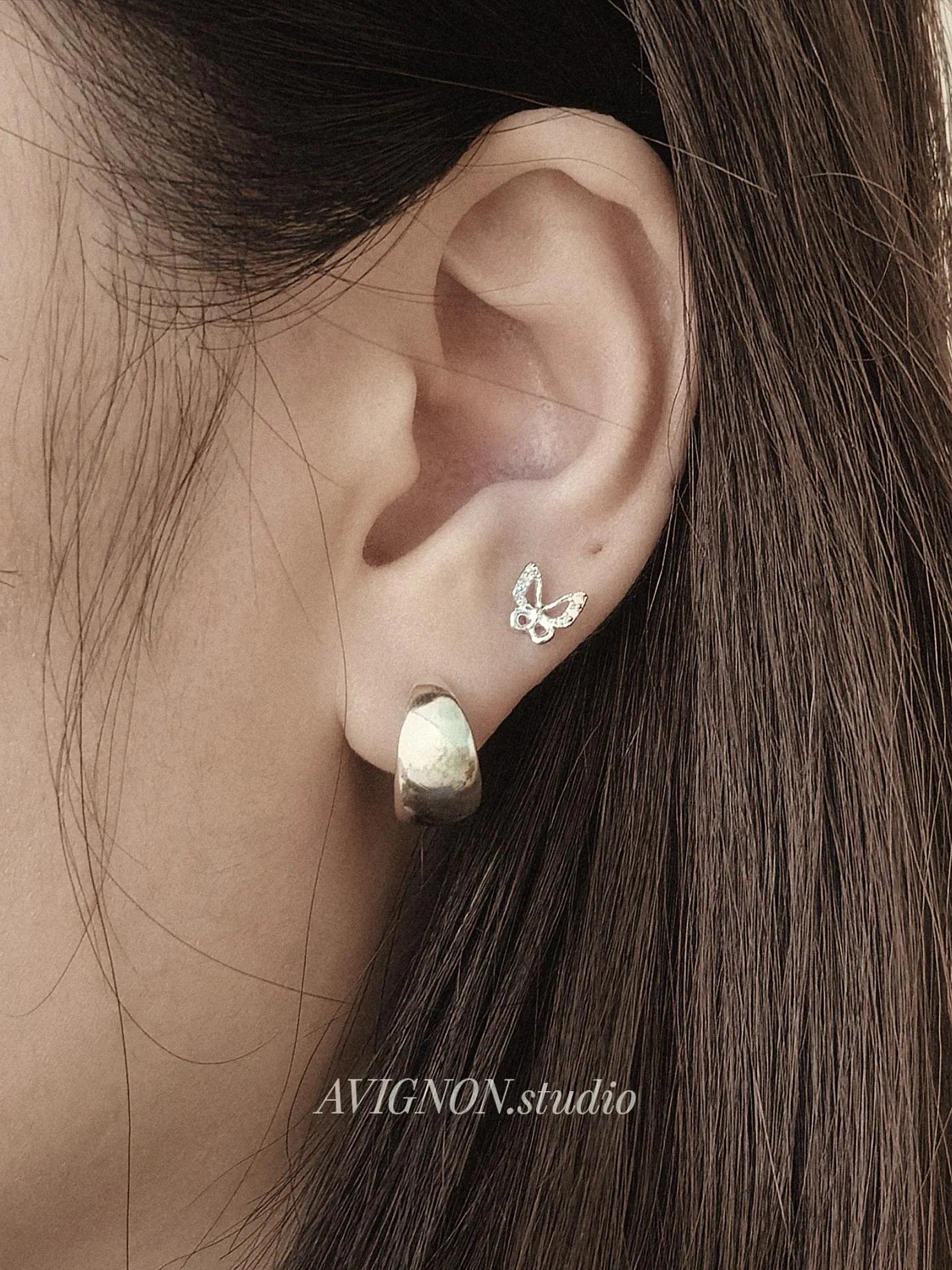 Sterling silver butterfly piercing. screwball stud.