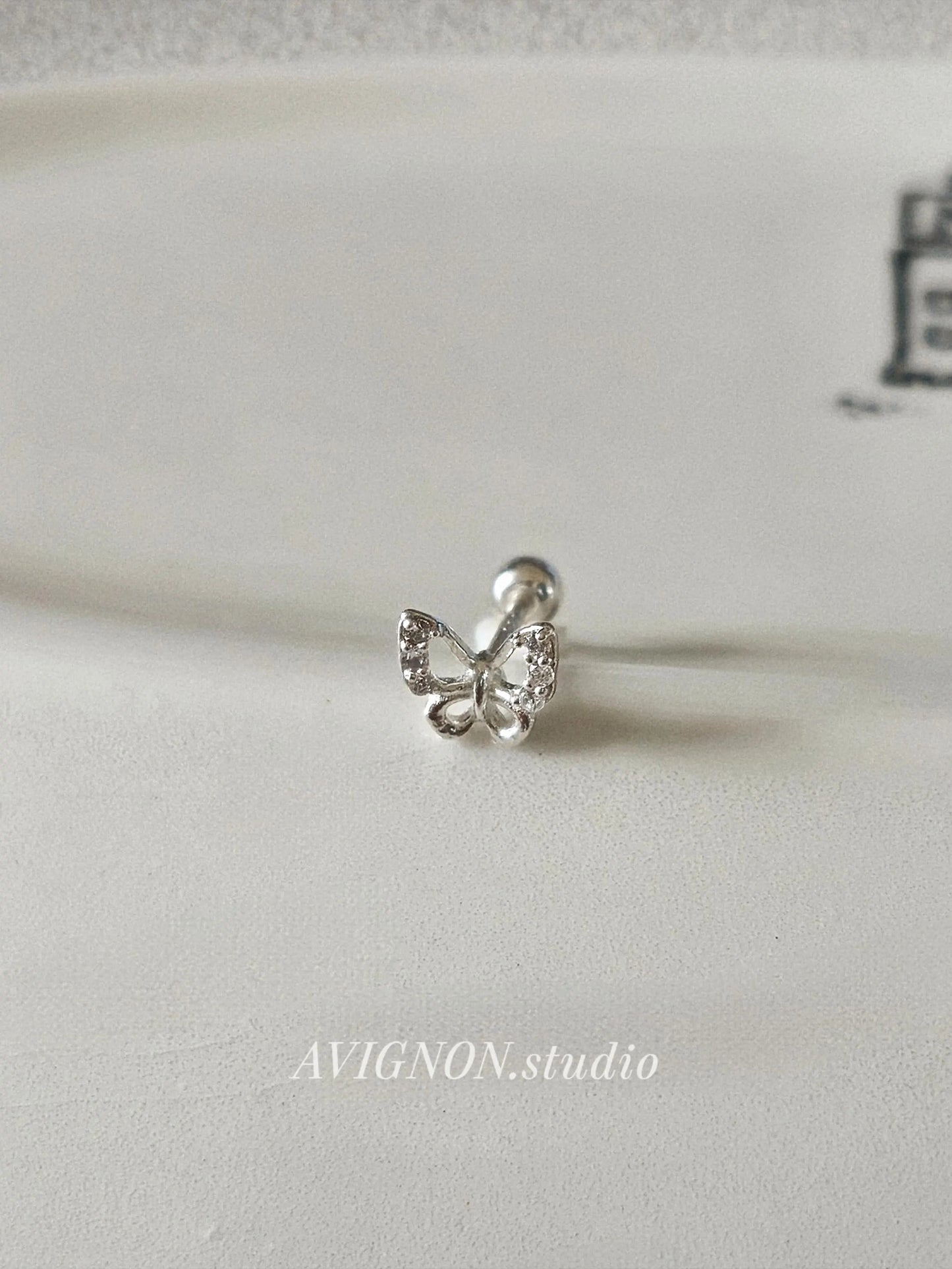 Sterling silver butterfly piercing. screwball stud.