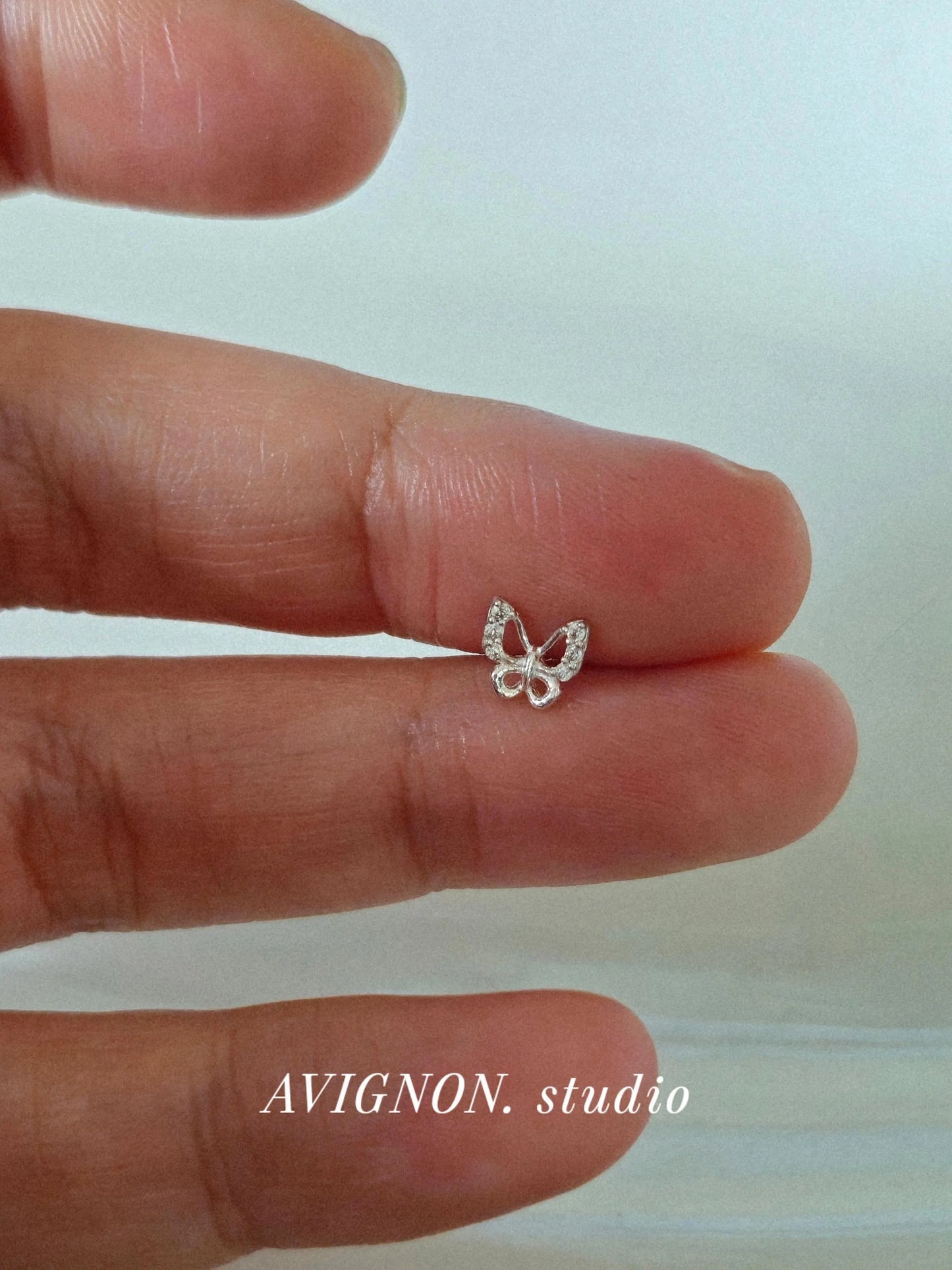 Sterling silver butterfly piercing. screwball stud.