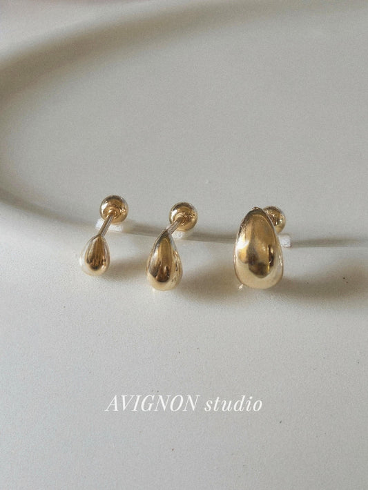14k solid gold Teardrop screwball piercing. Teardrop piercing.
