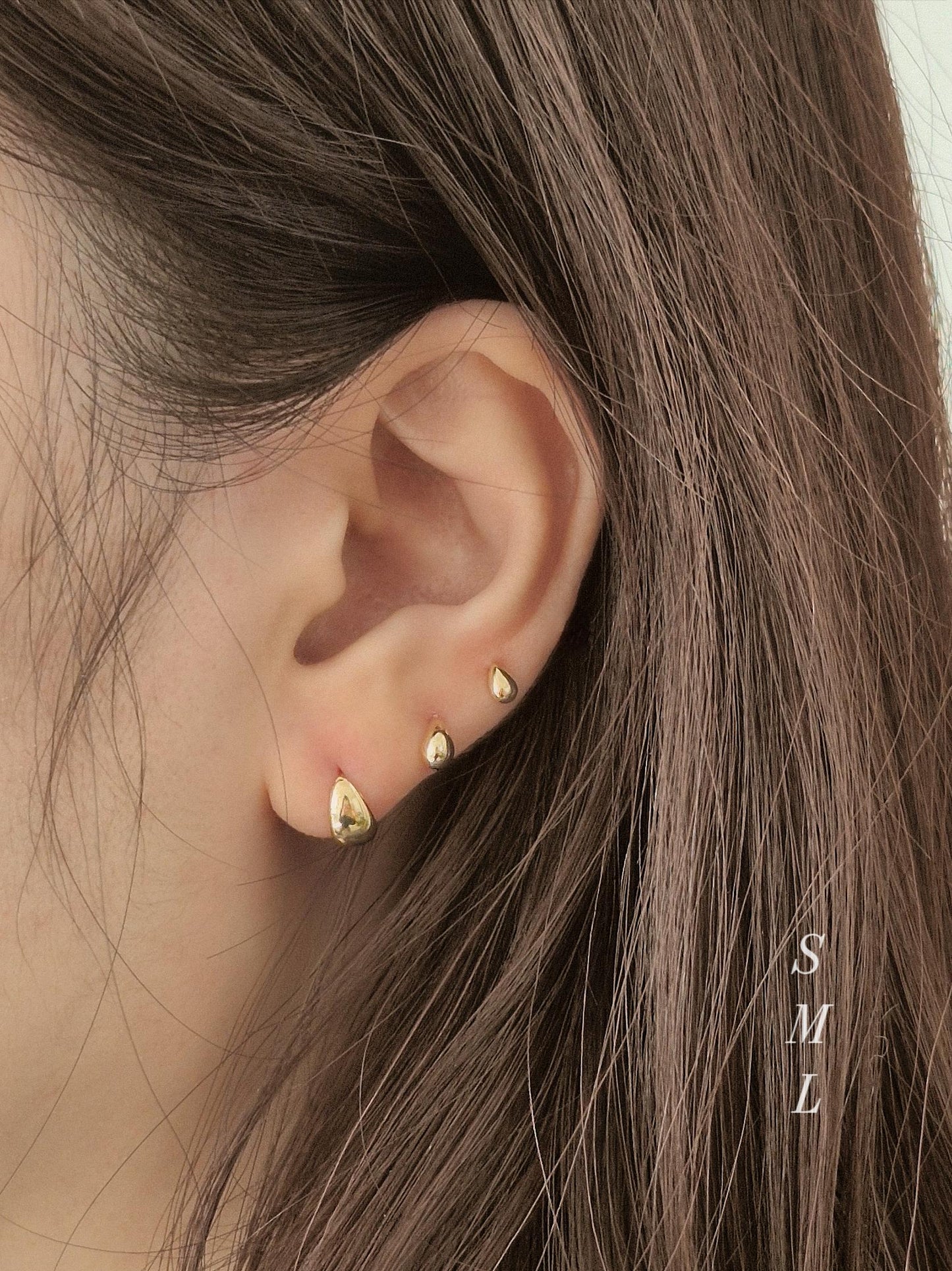 14k solid gold Teardrop screwball piercing. Teardrop piercing.