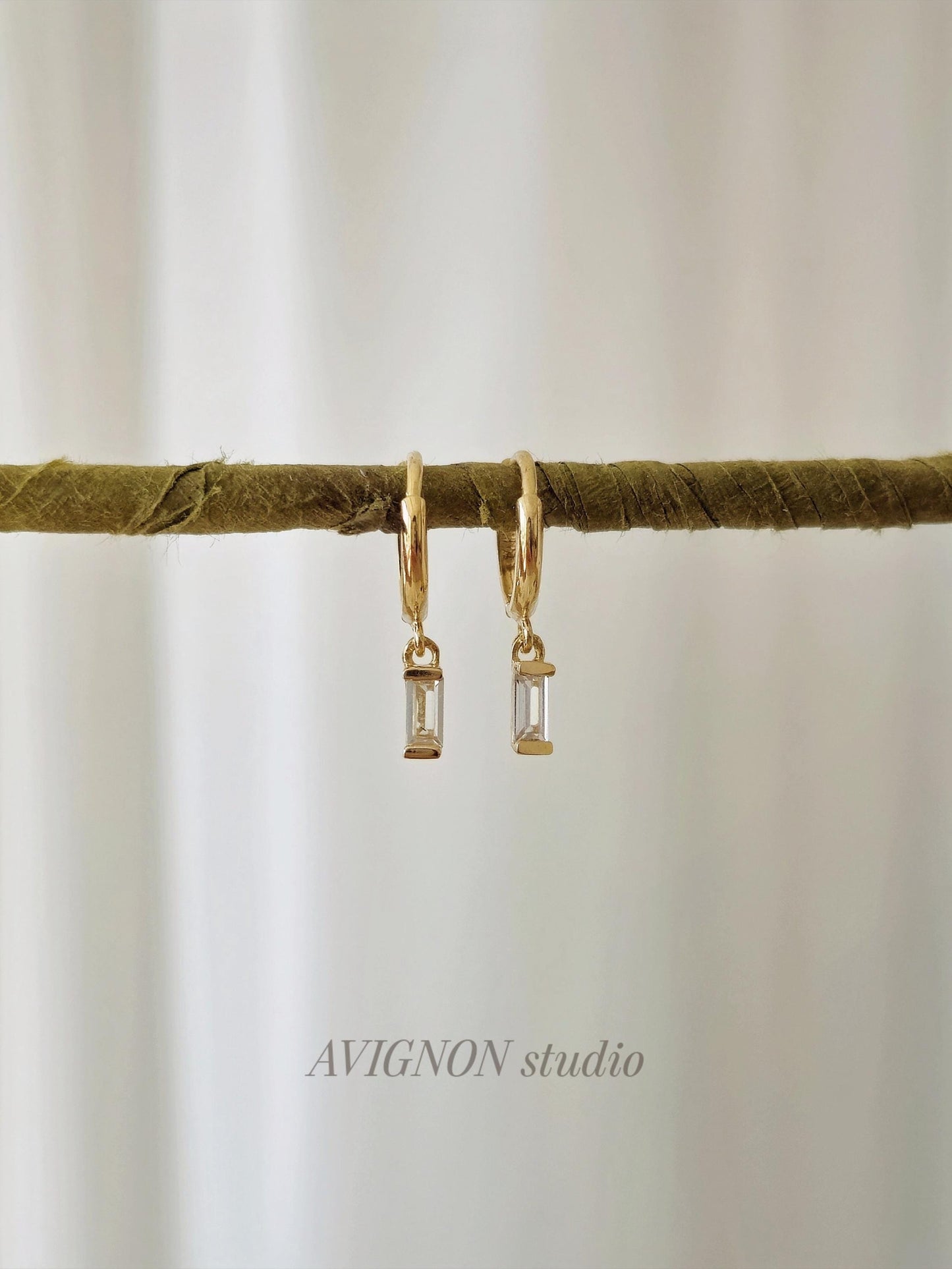 14k solid gold baguette cubic earrings. gold huggie earrings. Baguette drop earrings. Baguette dangle earrings.