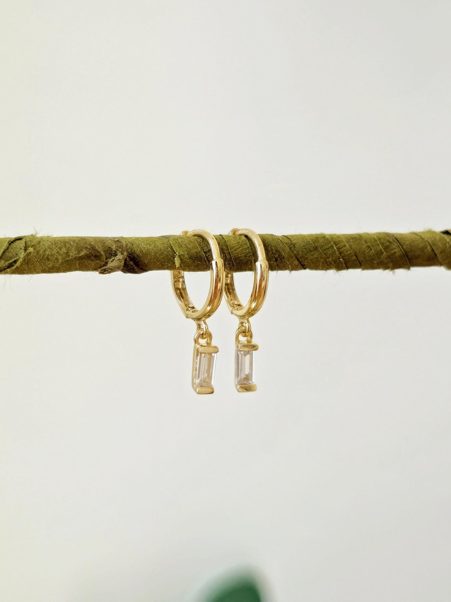 14k solid gold baguette cubic earrings. gold huggie earrings. Baguette drop earrings. Baguette dangle earrings.
