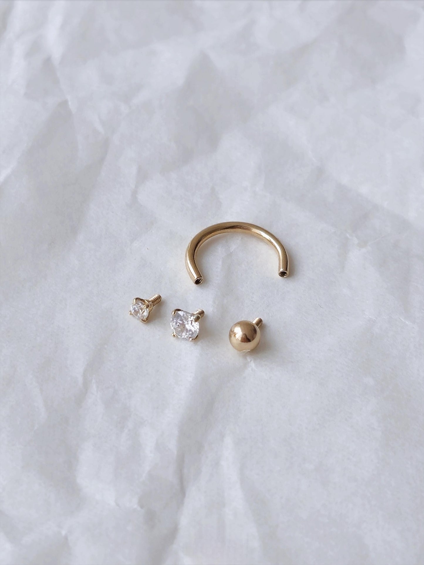 14k solid gold curve tube piercing. 2mm 3mm cubic ball piercing. U-shaped hoop.