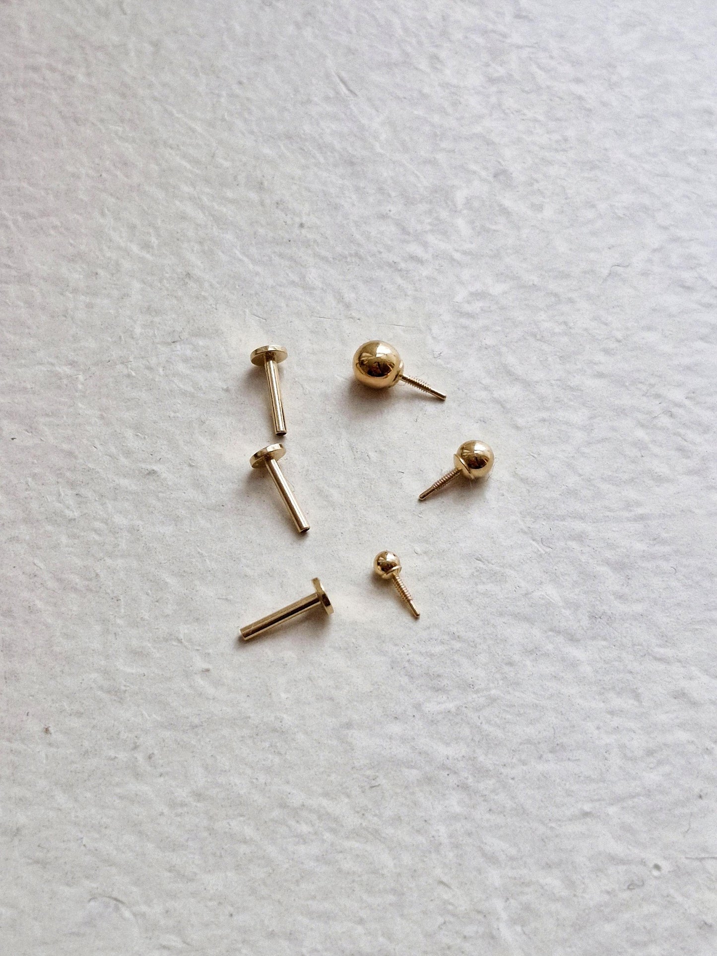 14k solid gold labret piercing. ball labret piercing. flat screw back.
