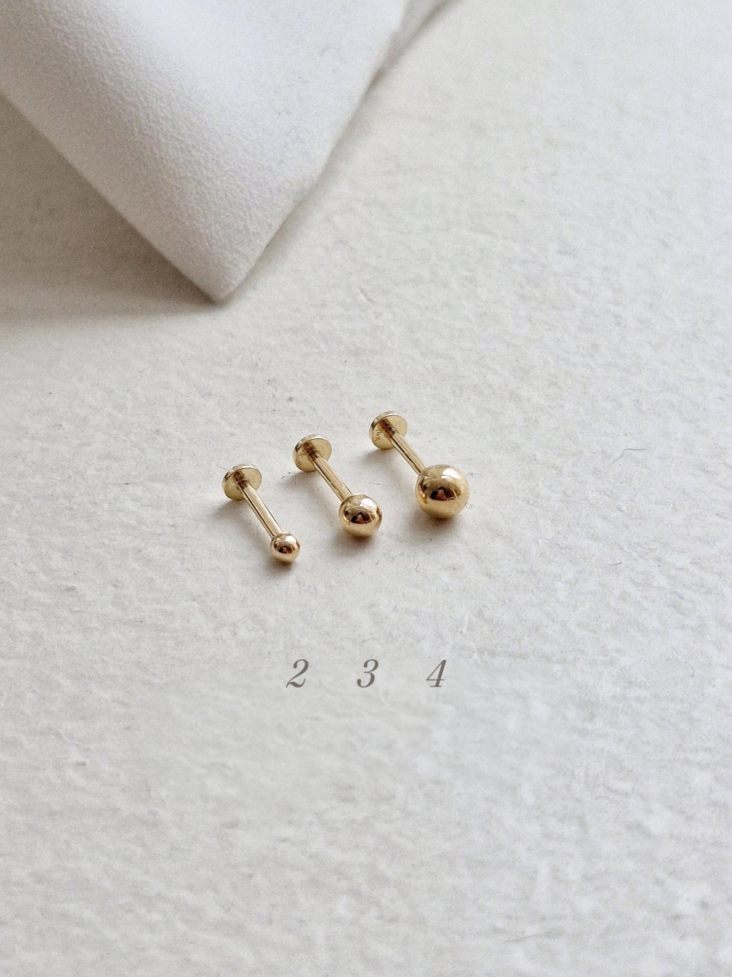 14k solid gold labret piercing. ball labret piercing. flat screw back.