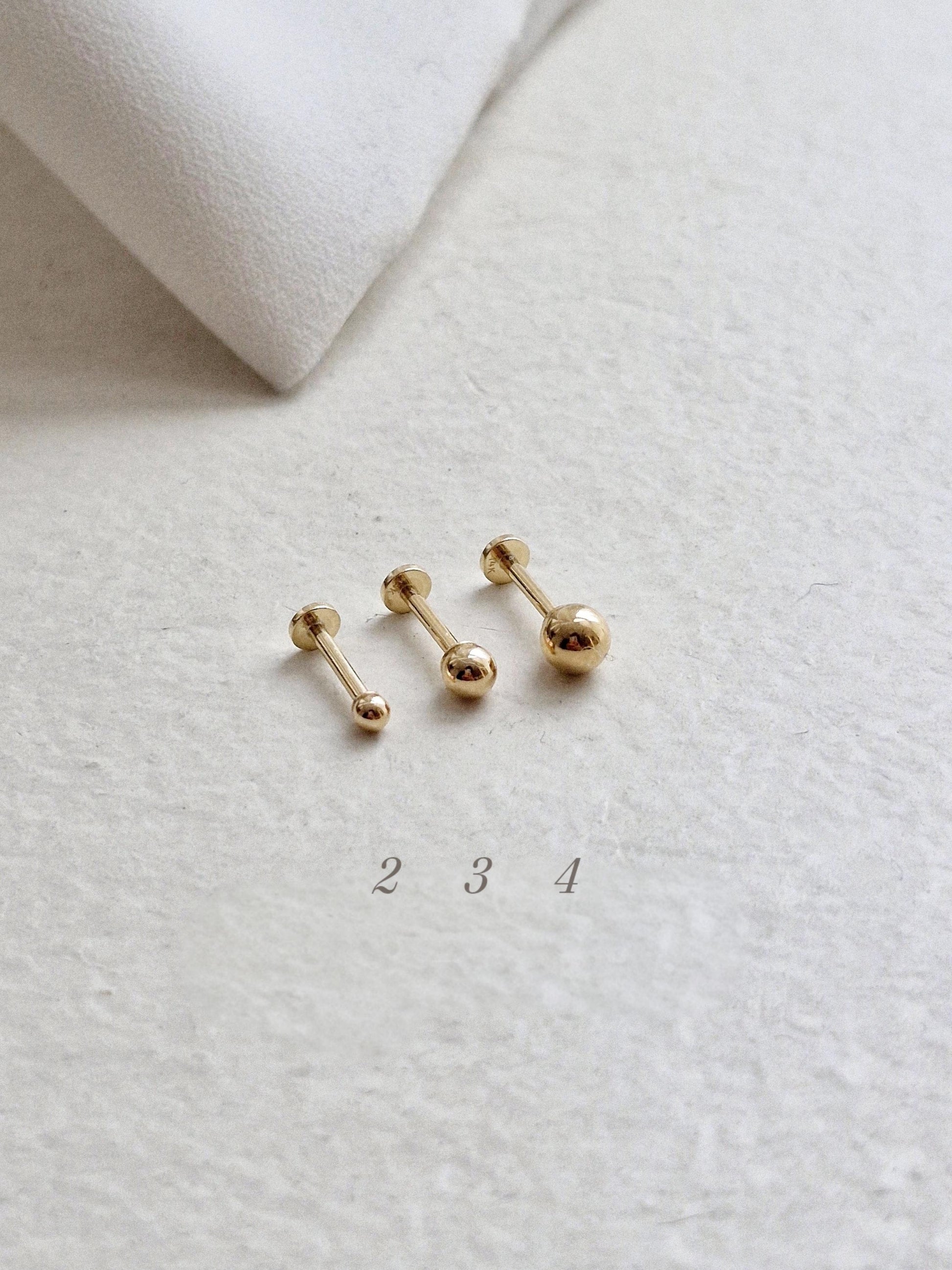 14k solid gold labret piercing. ball labret piercing. flat screw back.