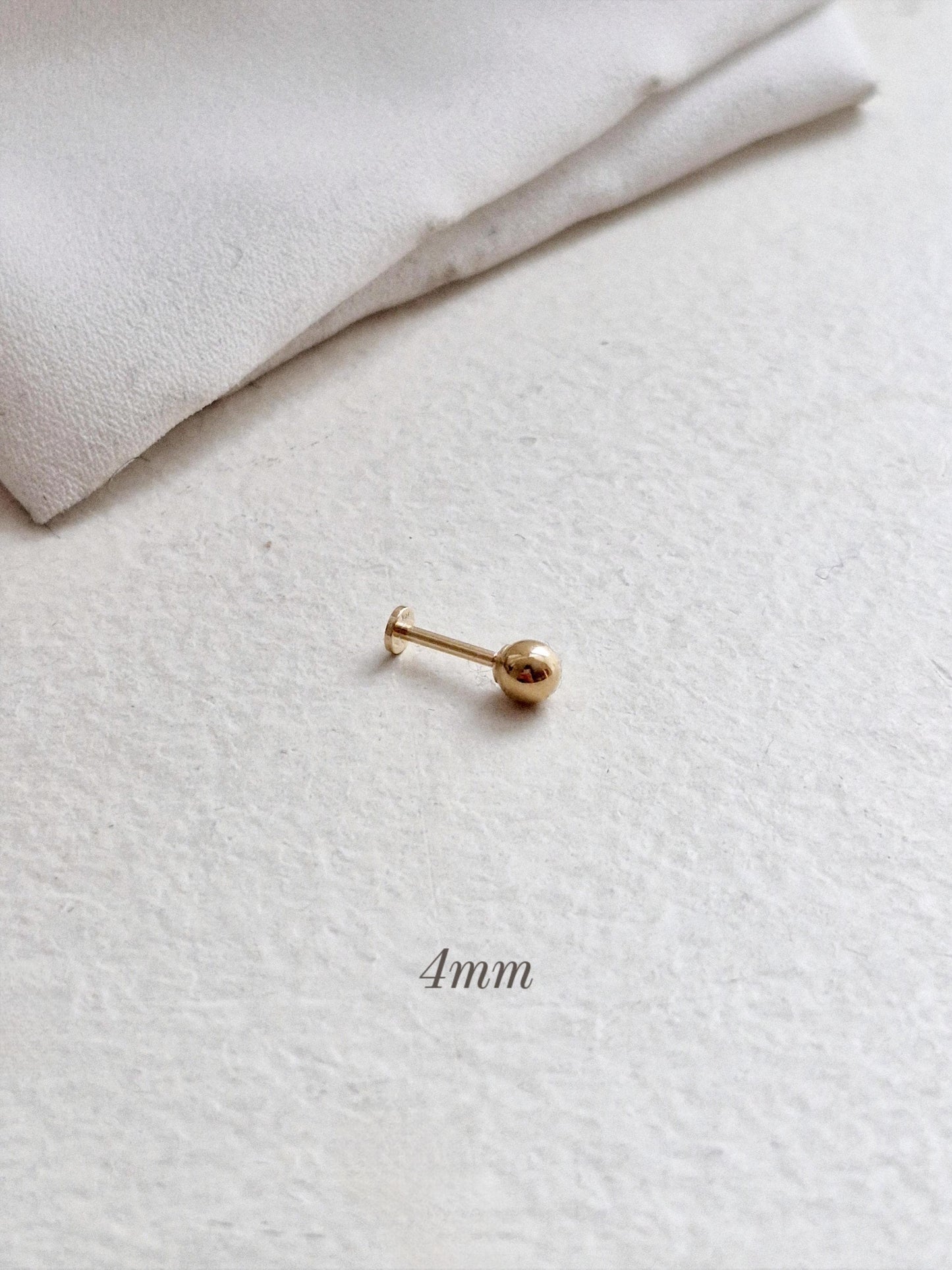 14k solid gold labret piercing. ball labret piercing. flat screw back.
