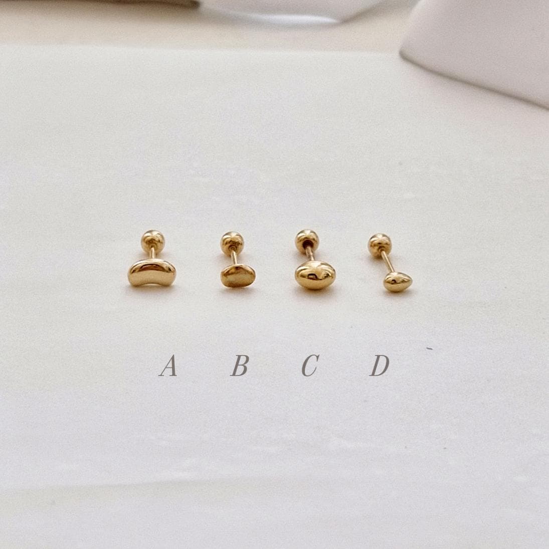 14k solid gold pebble, oval ball stud piercing stud screw ball earring. barbell screwback.21G. tragus, helix. Price for single.