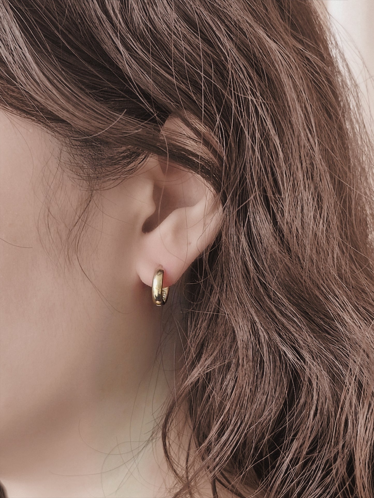 Minimal sterling silver hoop earrings.