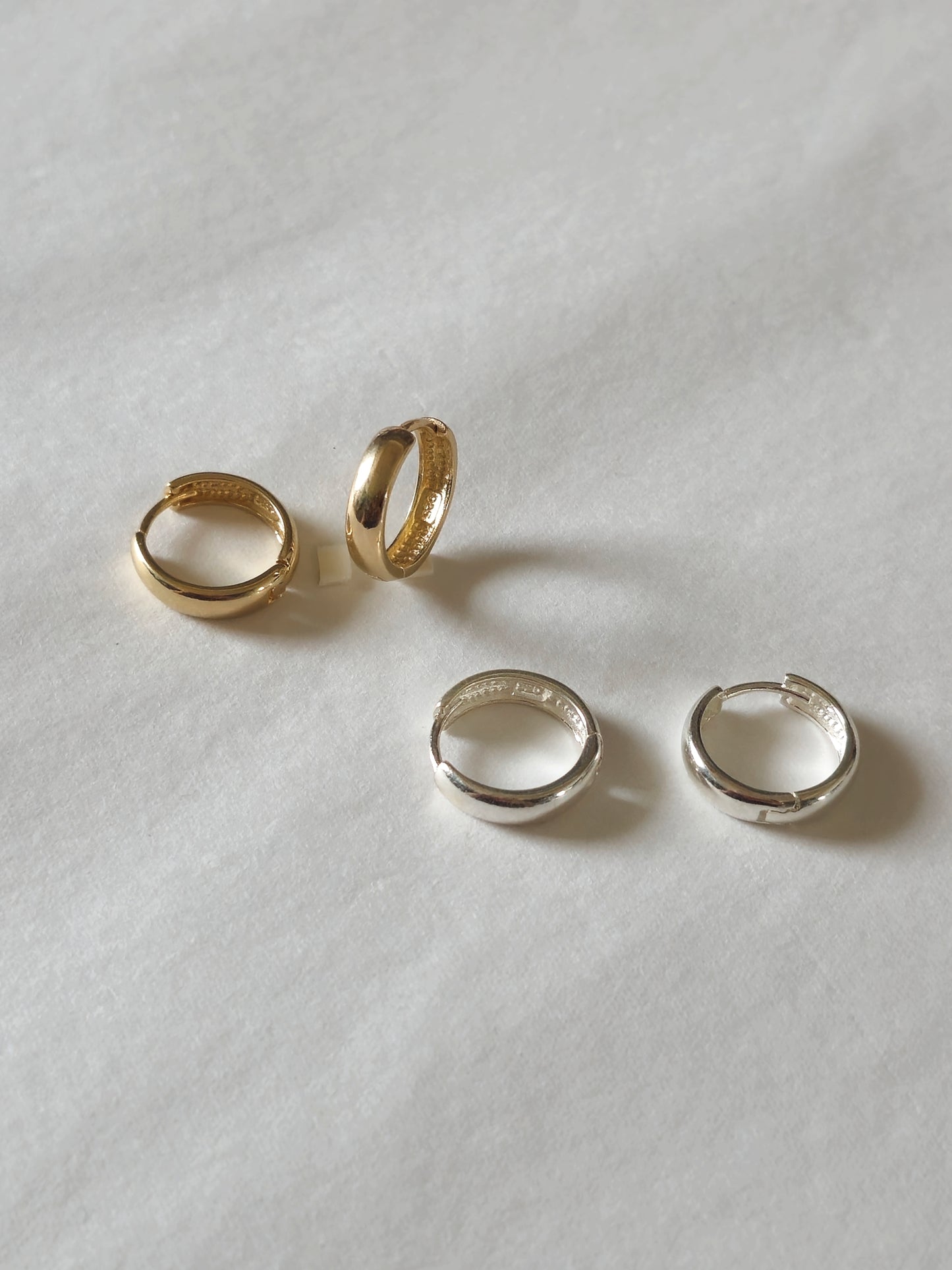 Minimal sterling silver hoop earrings.